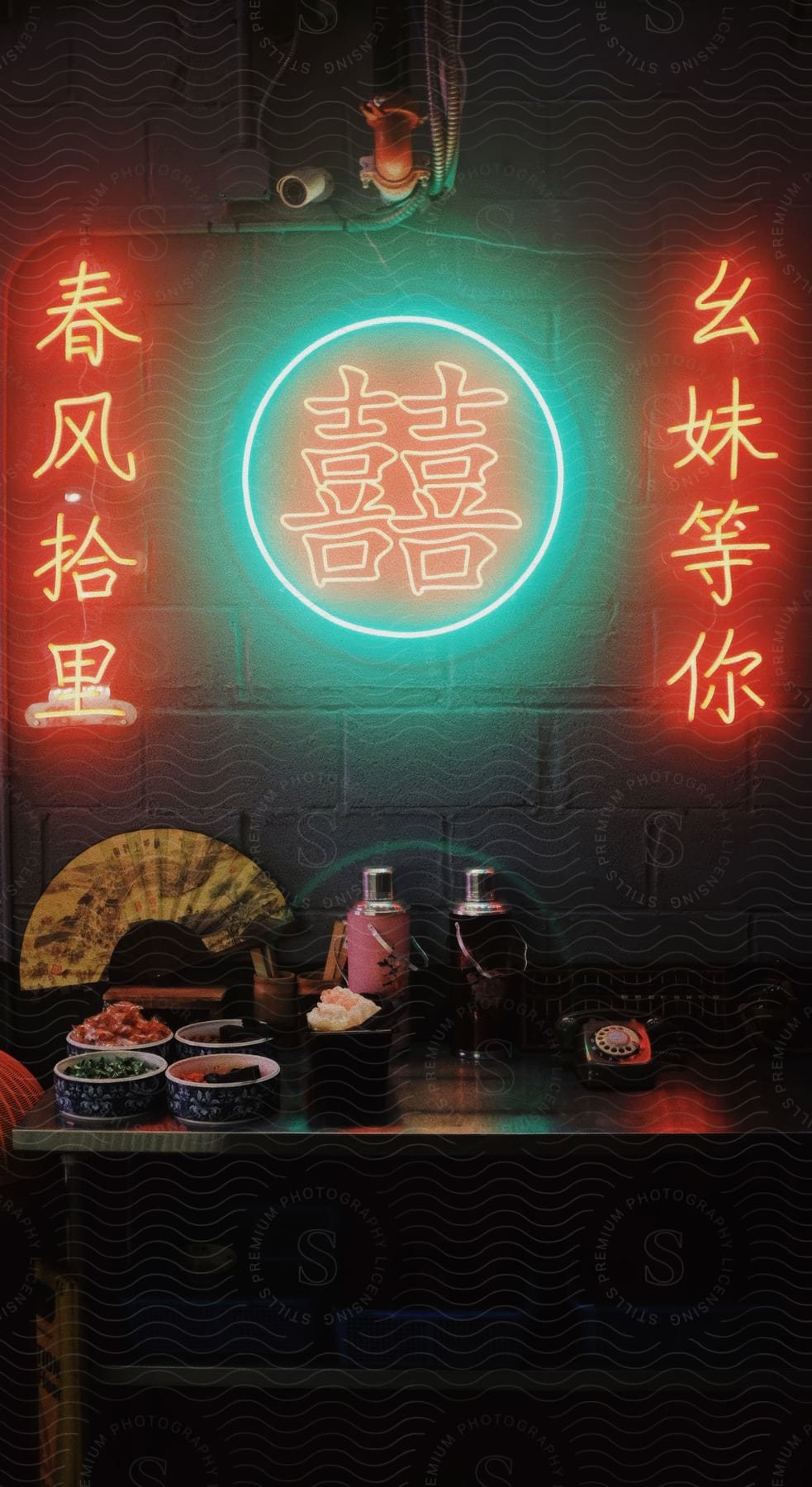 The inside of a restaurant with neon signs on the wall