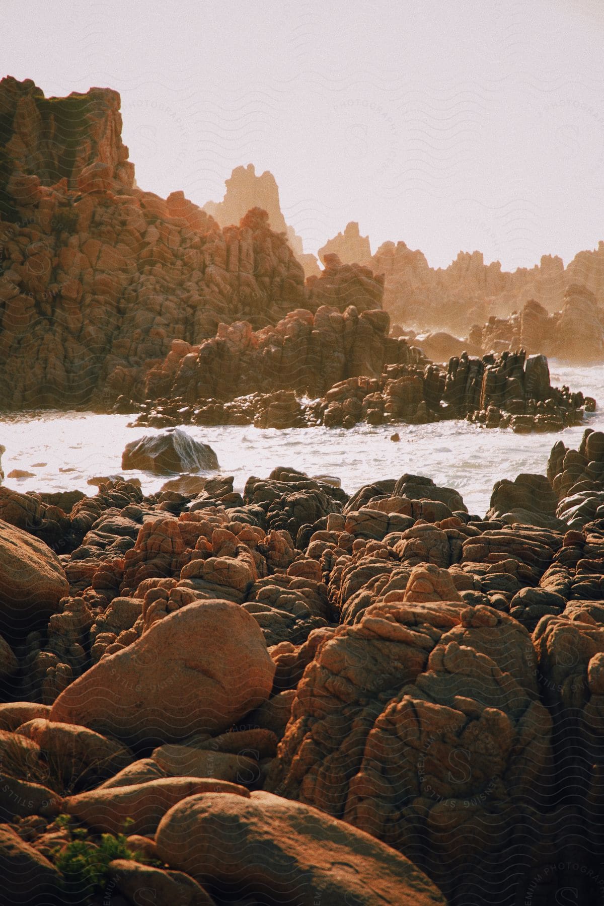 A view of a lot of rocks along the edge of a coast