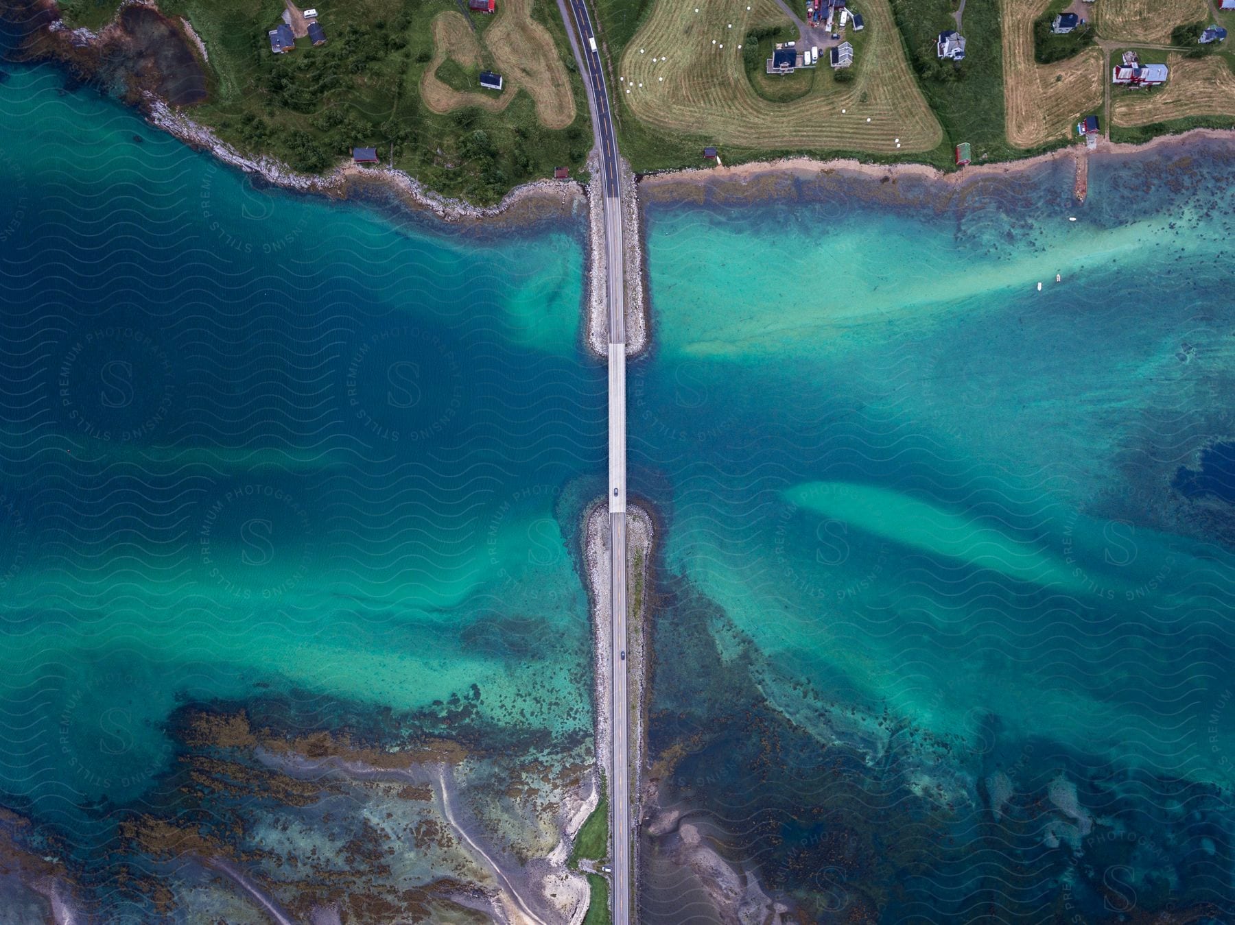 a bridge over a water with clear blue