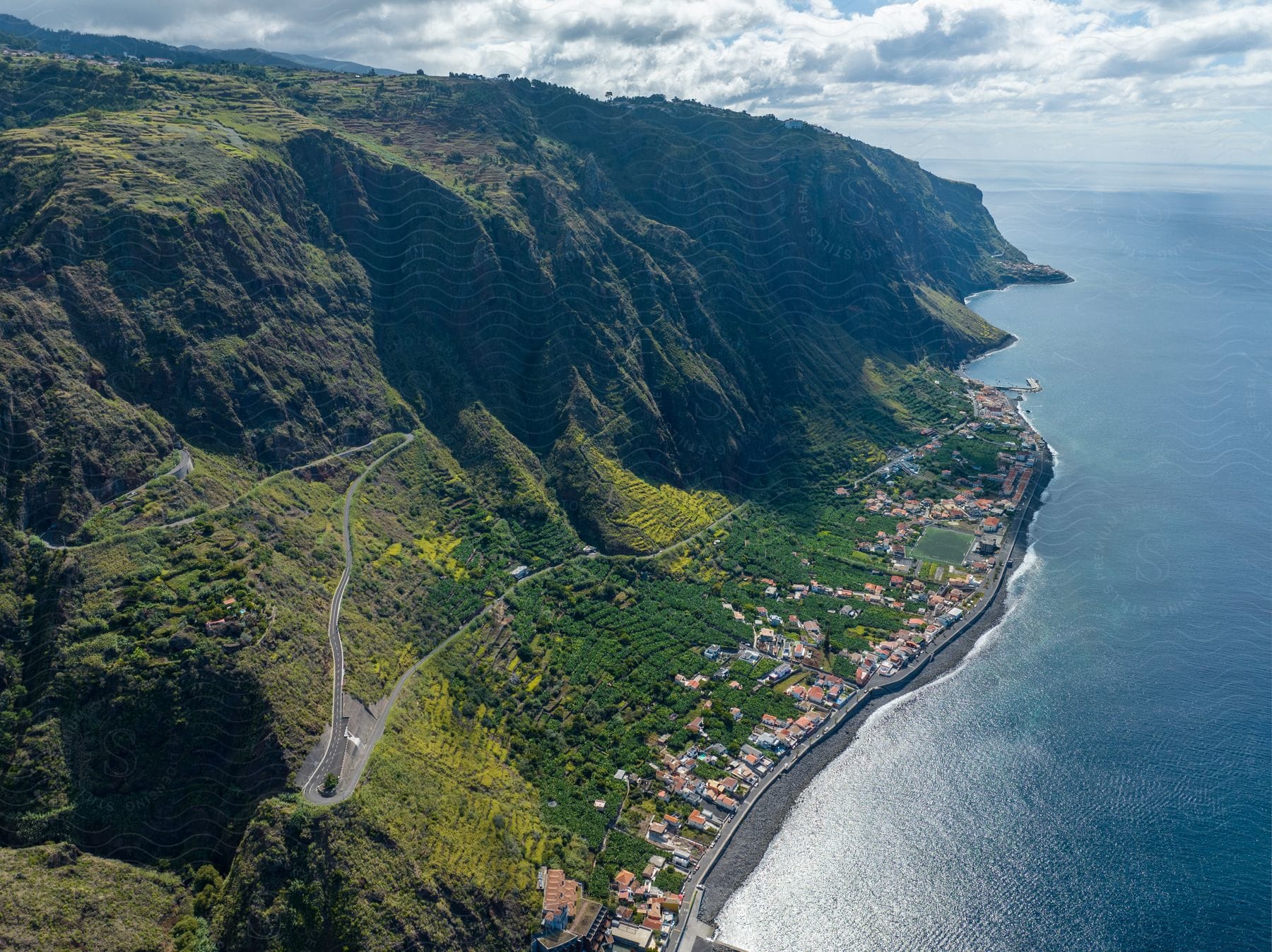 An aerial view of the coast on a sunny day