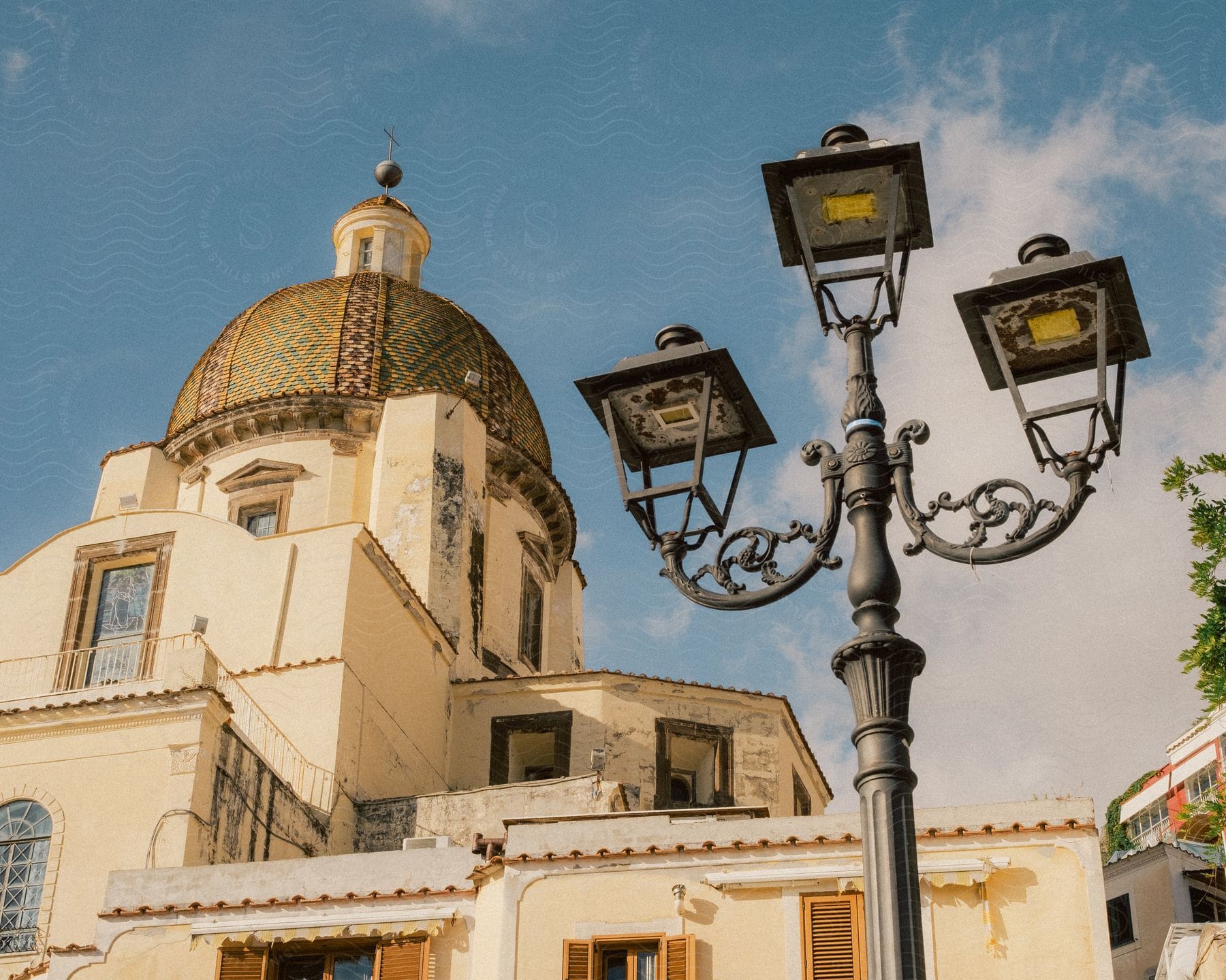 Exterior architecture of the Chiesa di Santa Maria Assunta against a blue sky