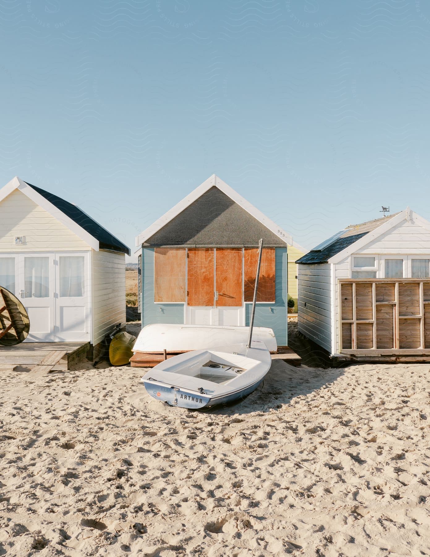 Three beach houses on a beach