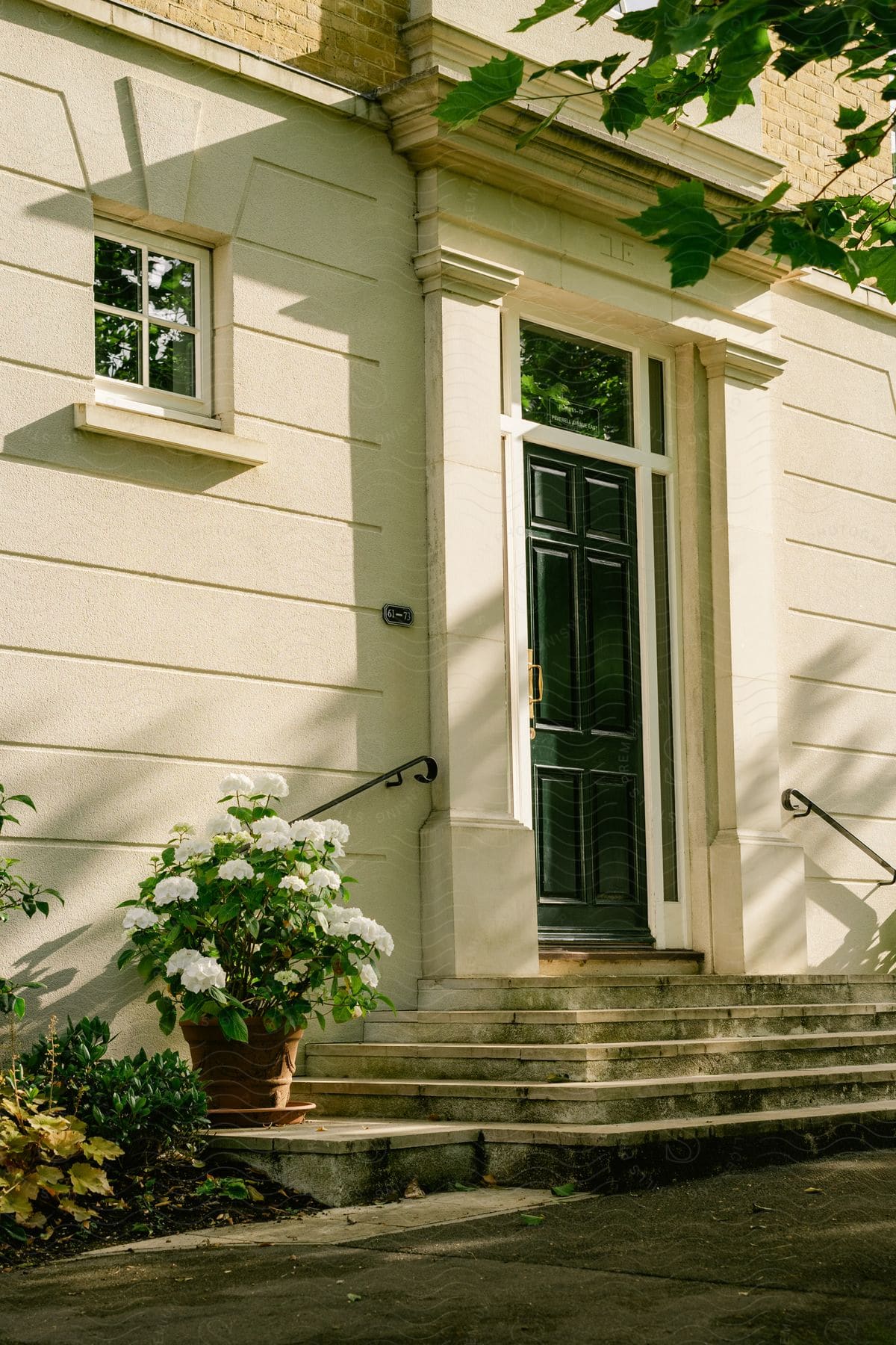 Exterior architecture of a door with a small scale of a house.