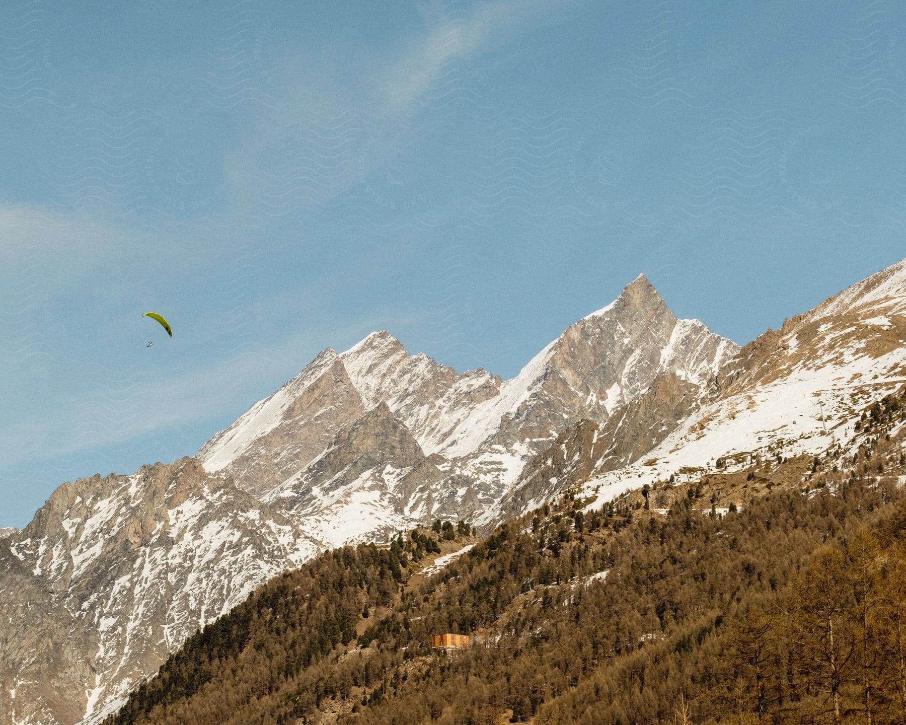 Parachuting down to the side of a mountain range