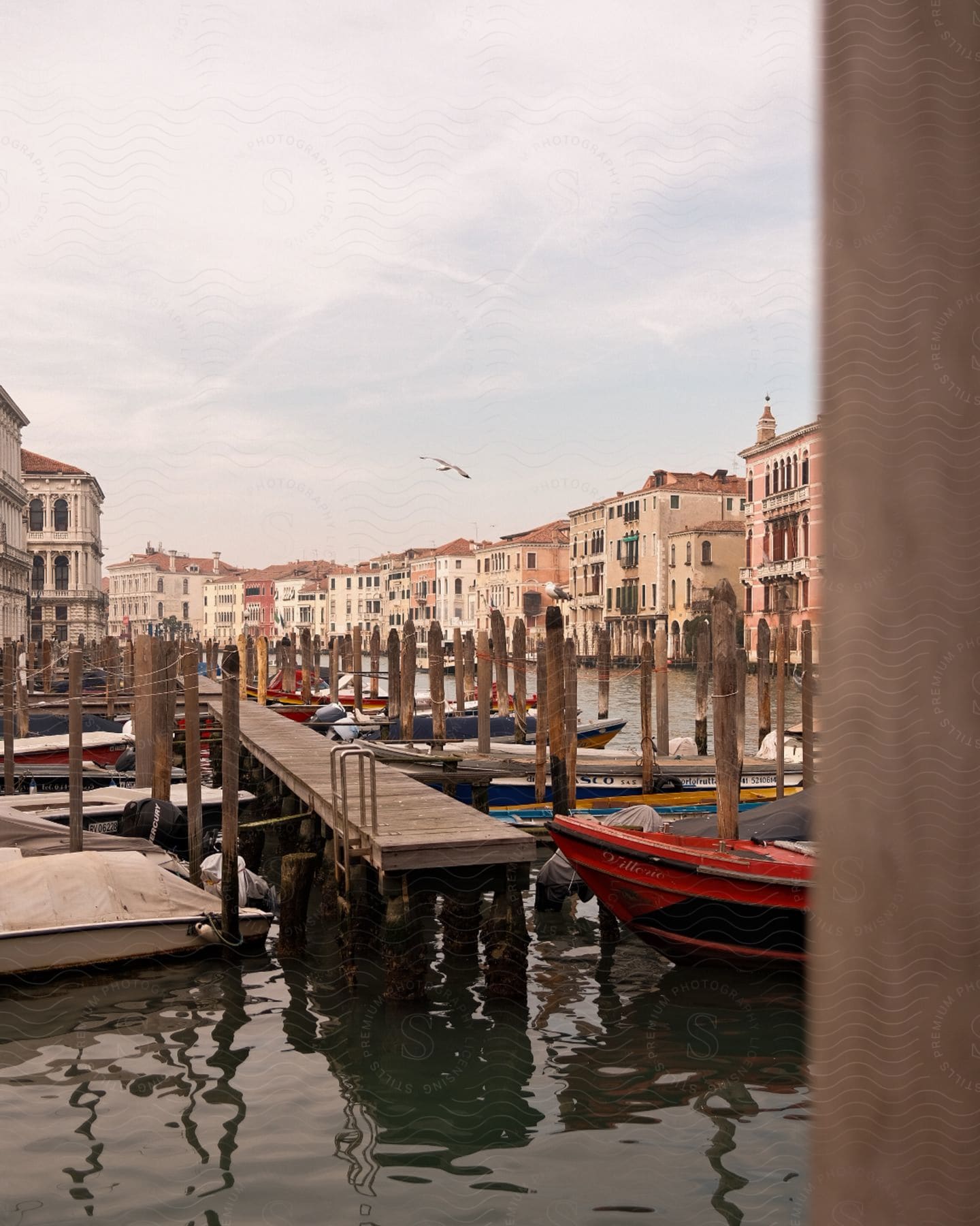 A View Of Some Boats Near The Edge Of Venice