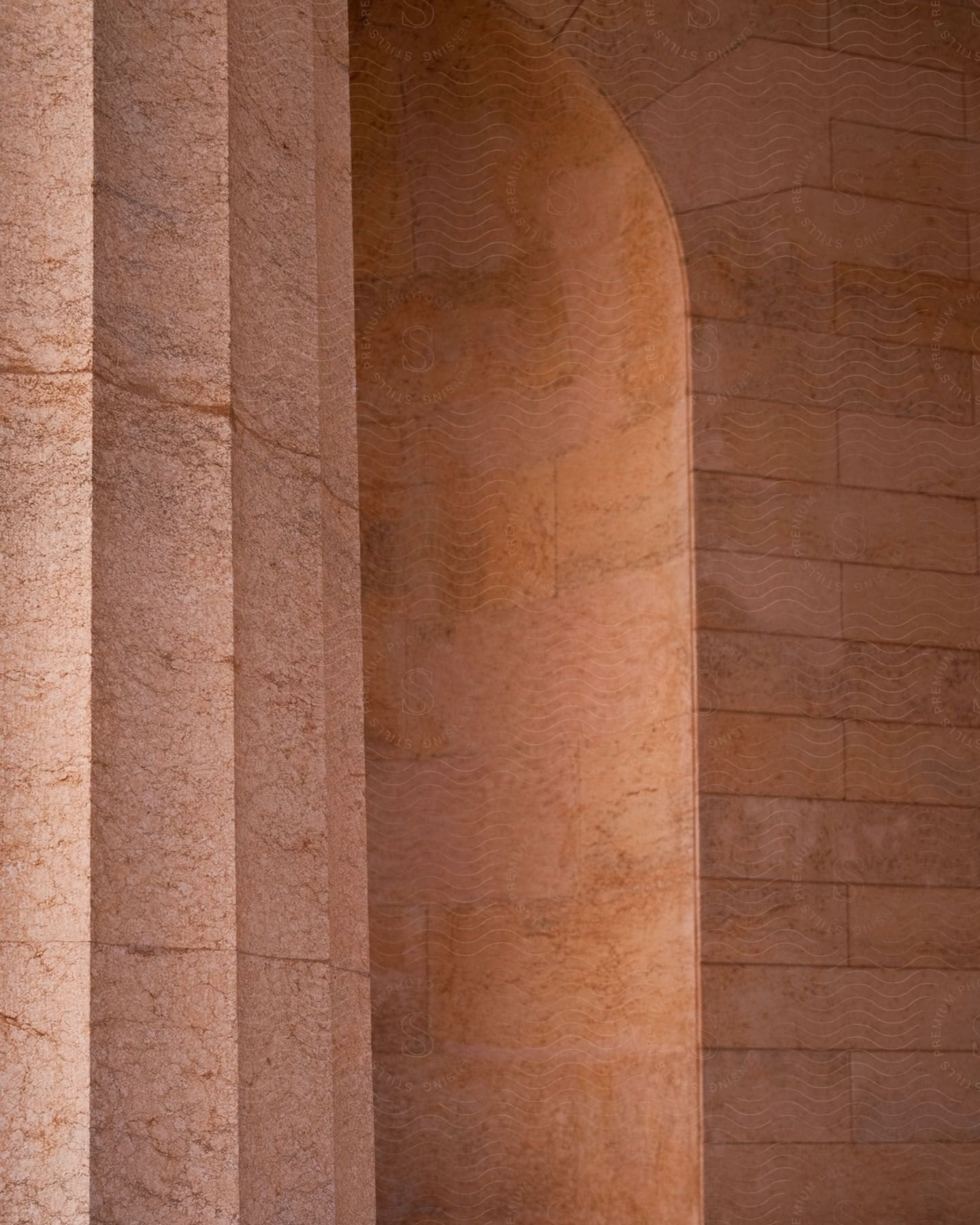Architecture of a wall with a column in sand color