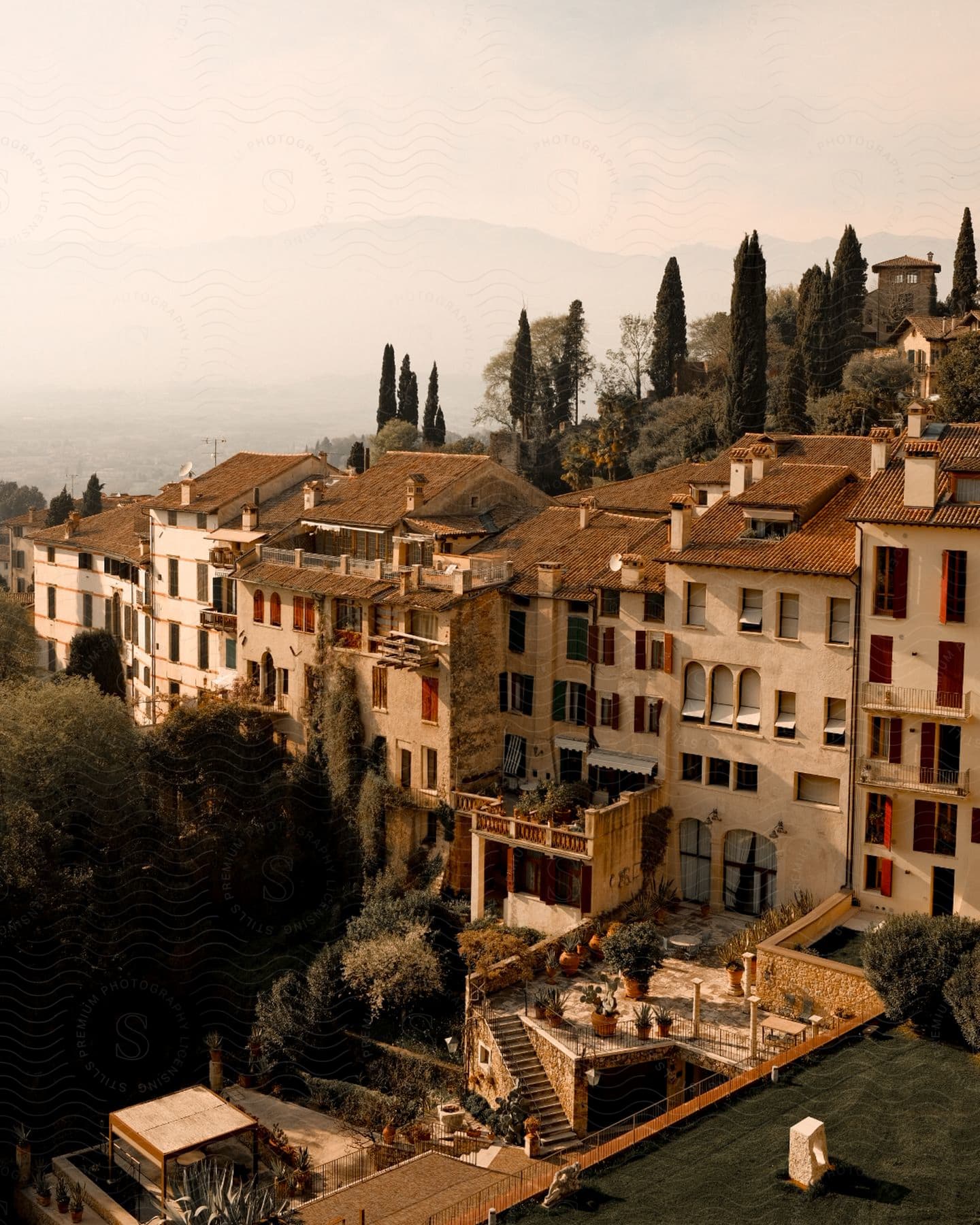 Panorama of old houses built in Hills against a cloudy sky.