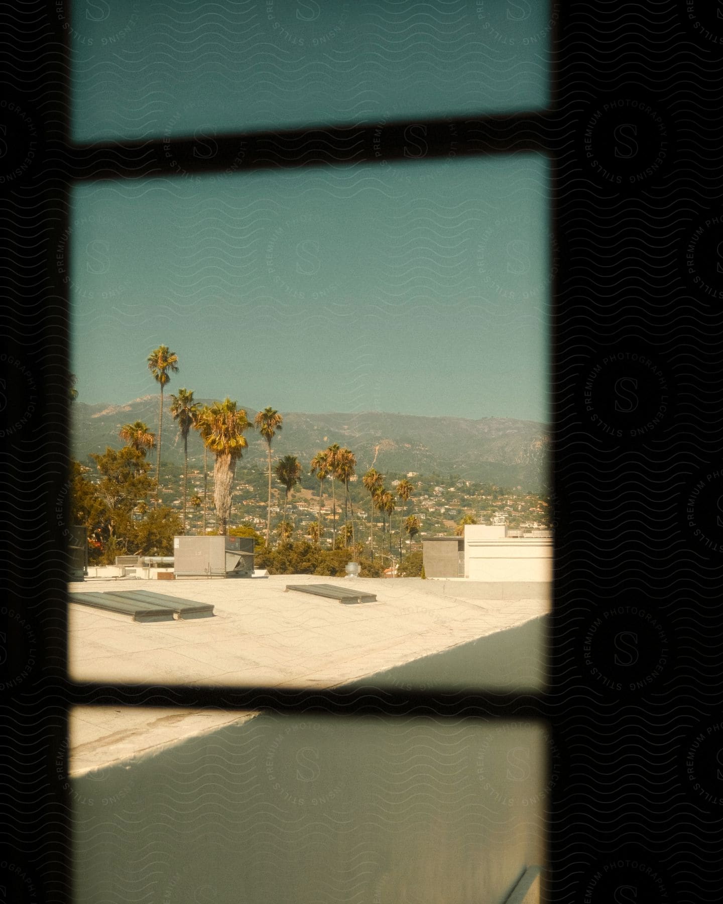 A view of a city through a rectangular window.