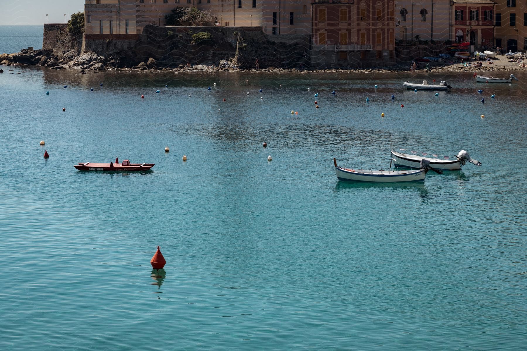 A charming harbor scene with colorful boats bobbing on the water, all set against the backdrop of a historic Italian city.