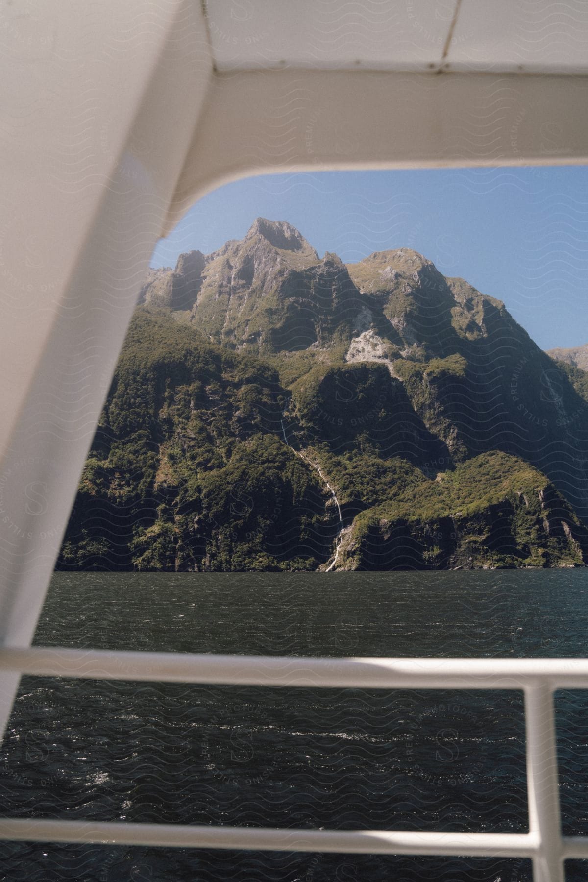 An shot of a mountain through a cruise ship