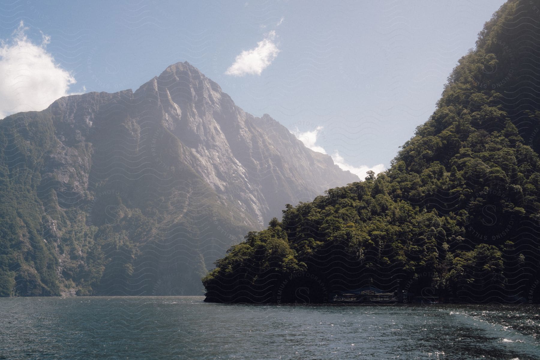 a body of water with a couple islands in the background.