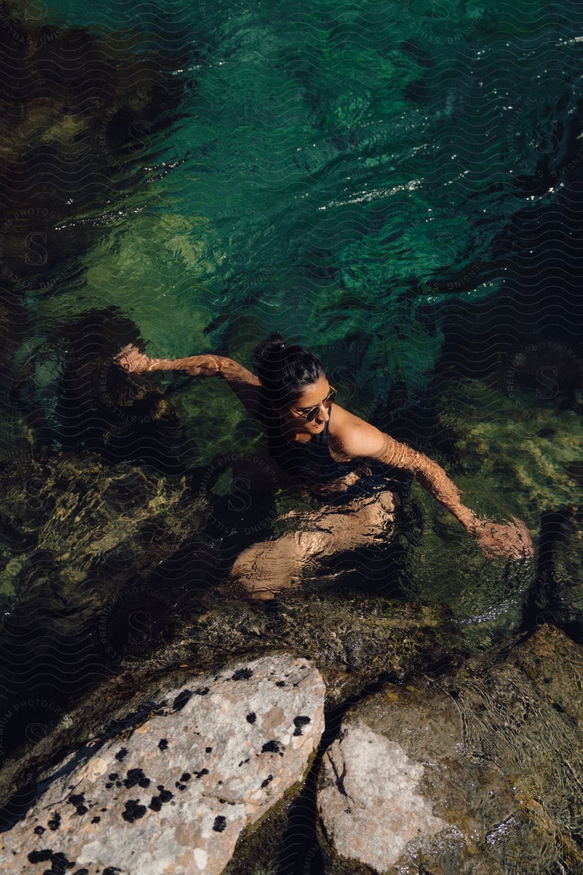 An image of a lady swimming the lake