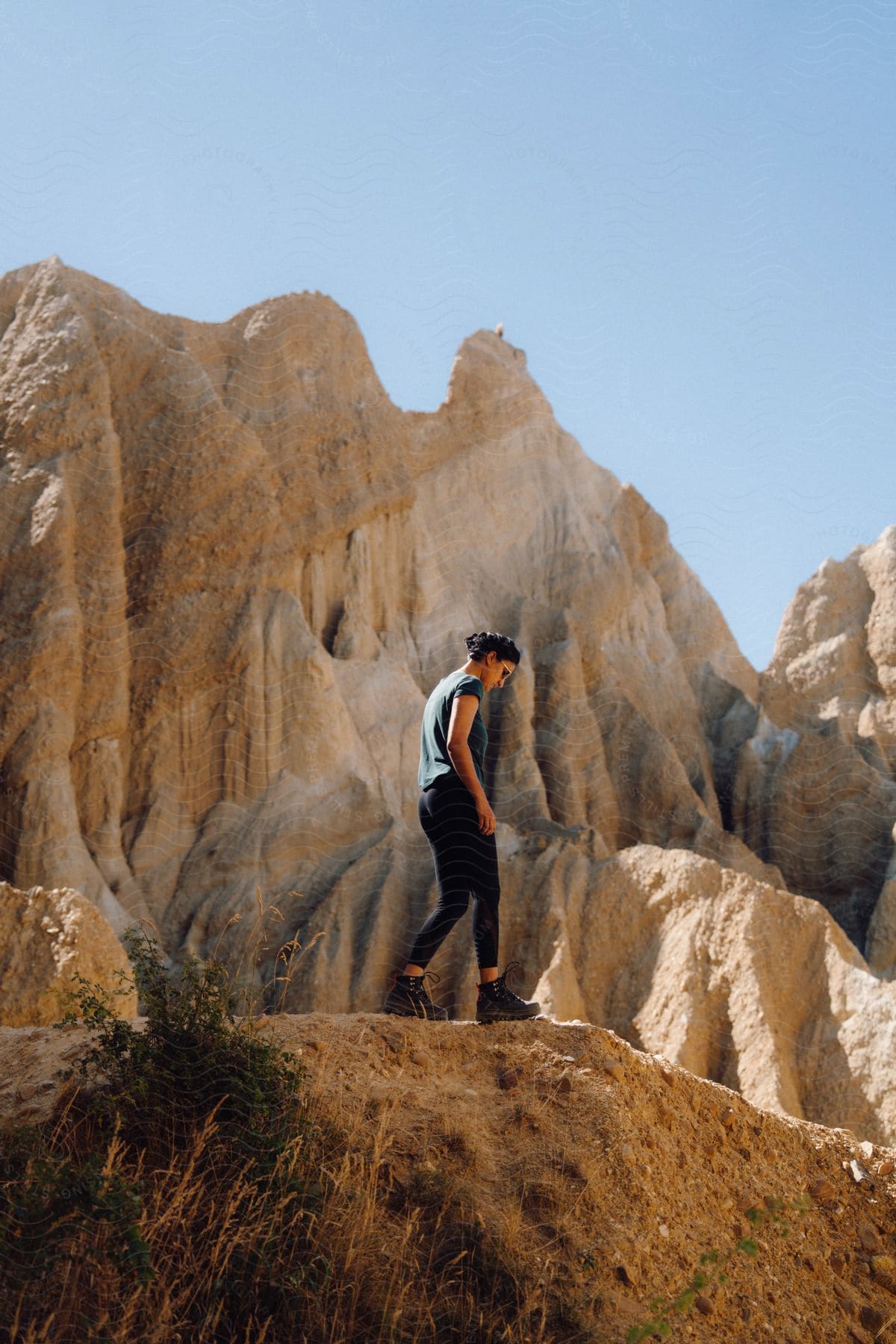 A woman out hiking in the desert on a sunny day