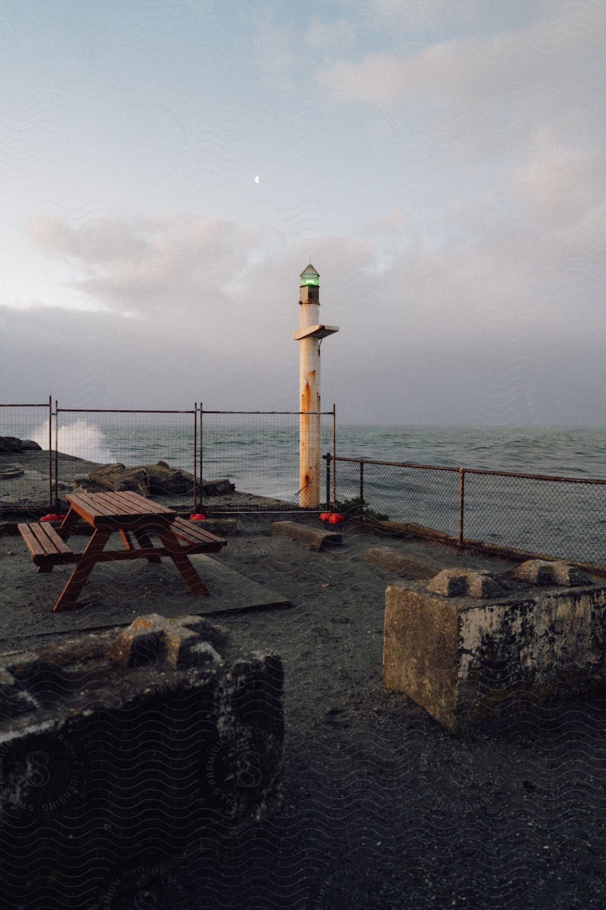 A Light On A Pole Outdoors Near The Coast