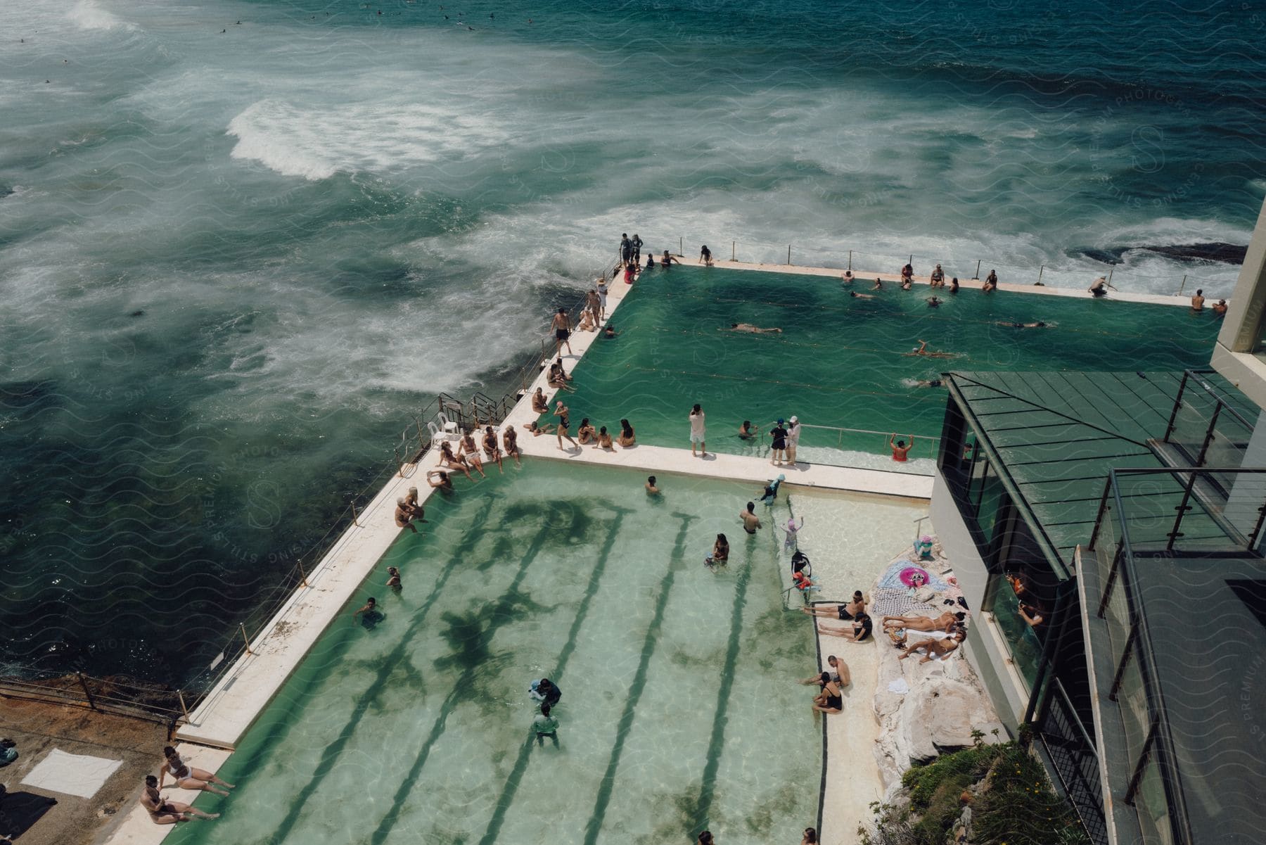 Panorama of tourists in the swimming pools of a seaside resort