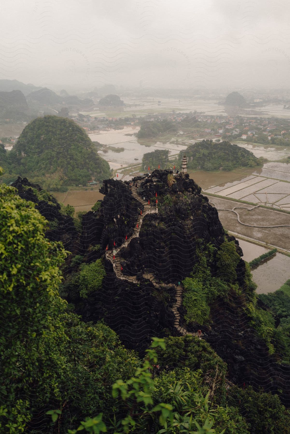 Panorama of a forested mountain trail in Mua Cave on the edge of agricultural lakes