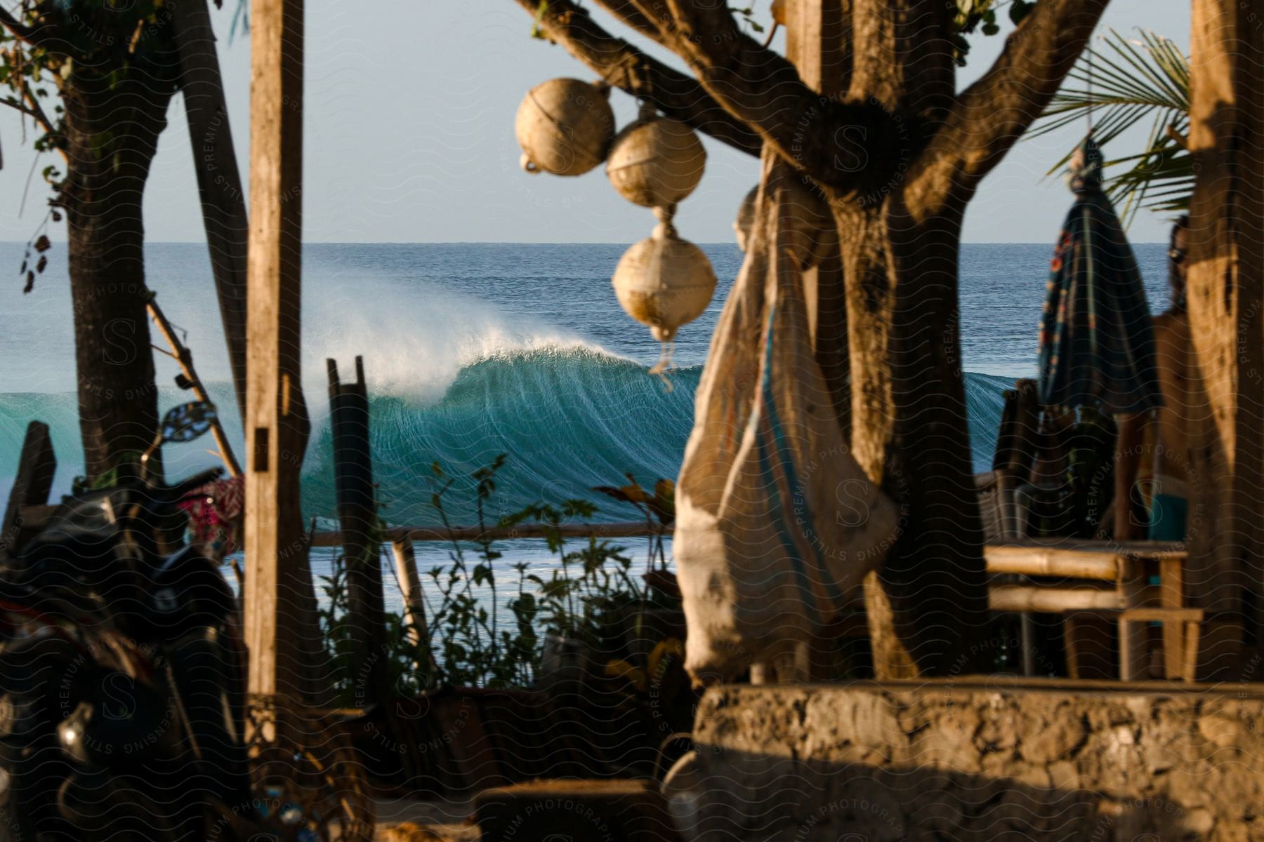 A tropical area with a large wave in the ocean