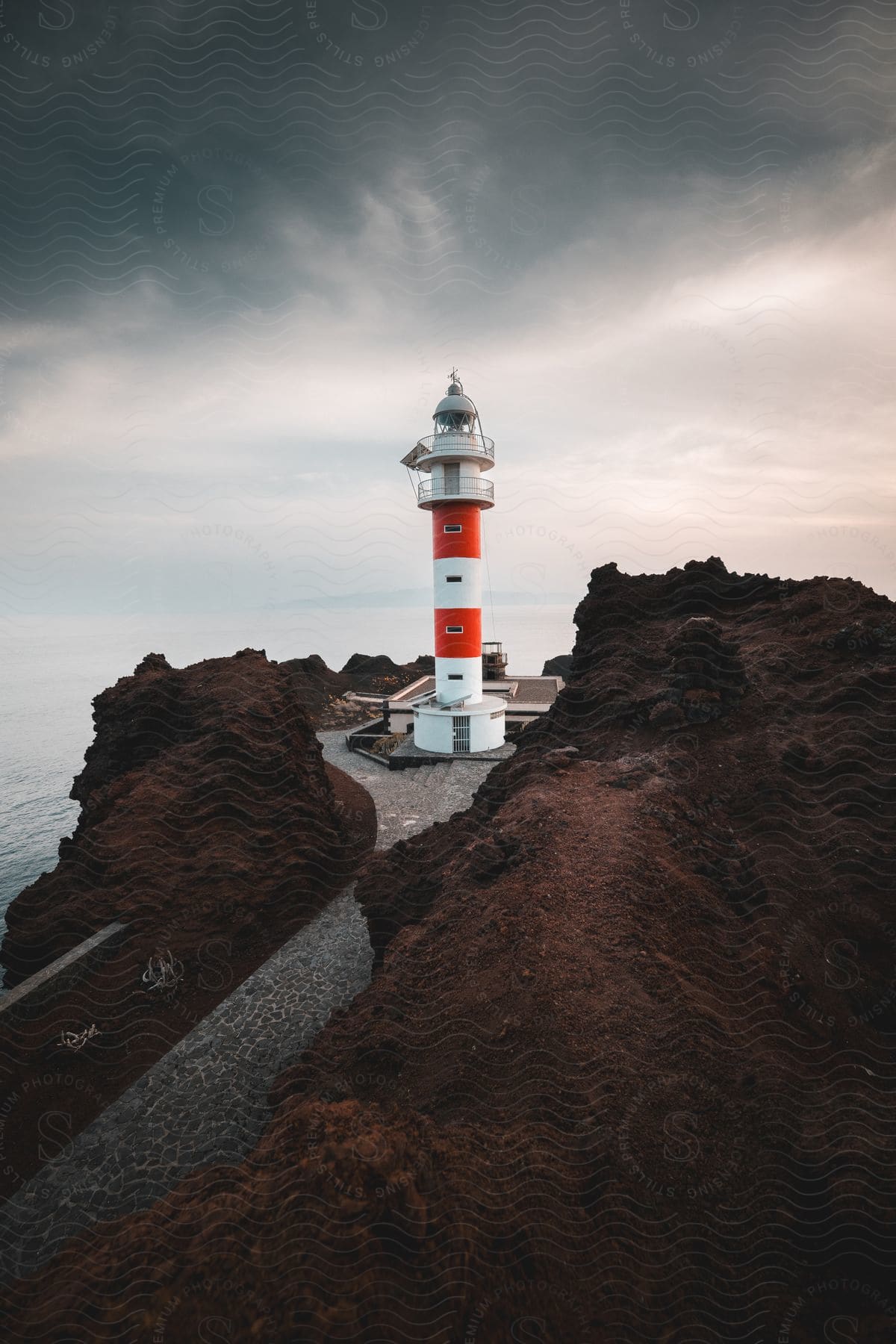 Lighthouse high on a promontory overlooking the water