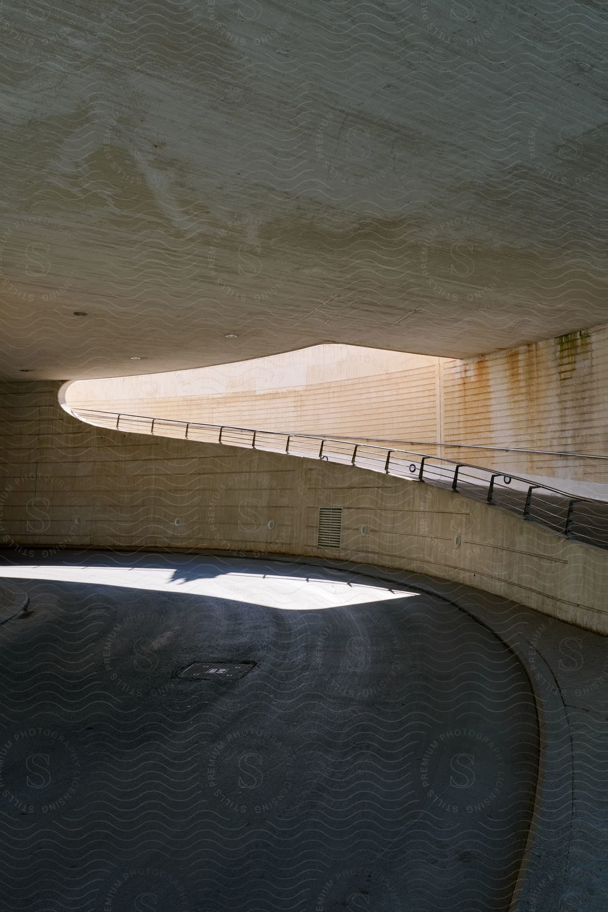 A tunnel leading underground is visible during the day.