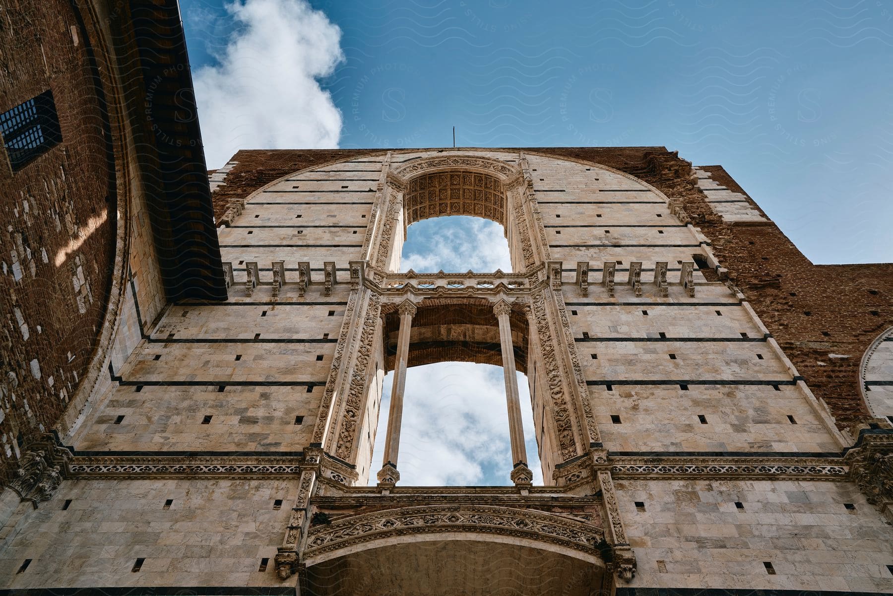 Facciatone exterior architecture on a blue sky day with clouds