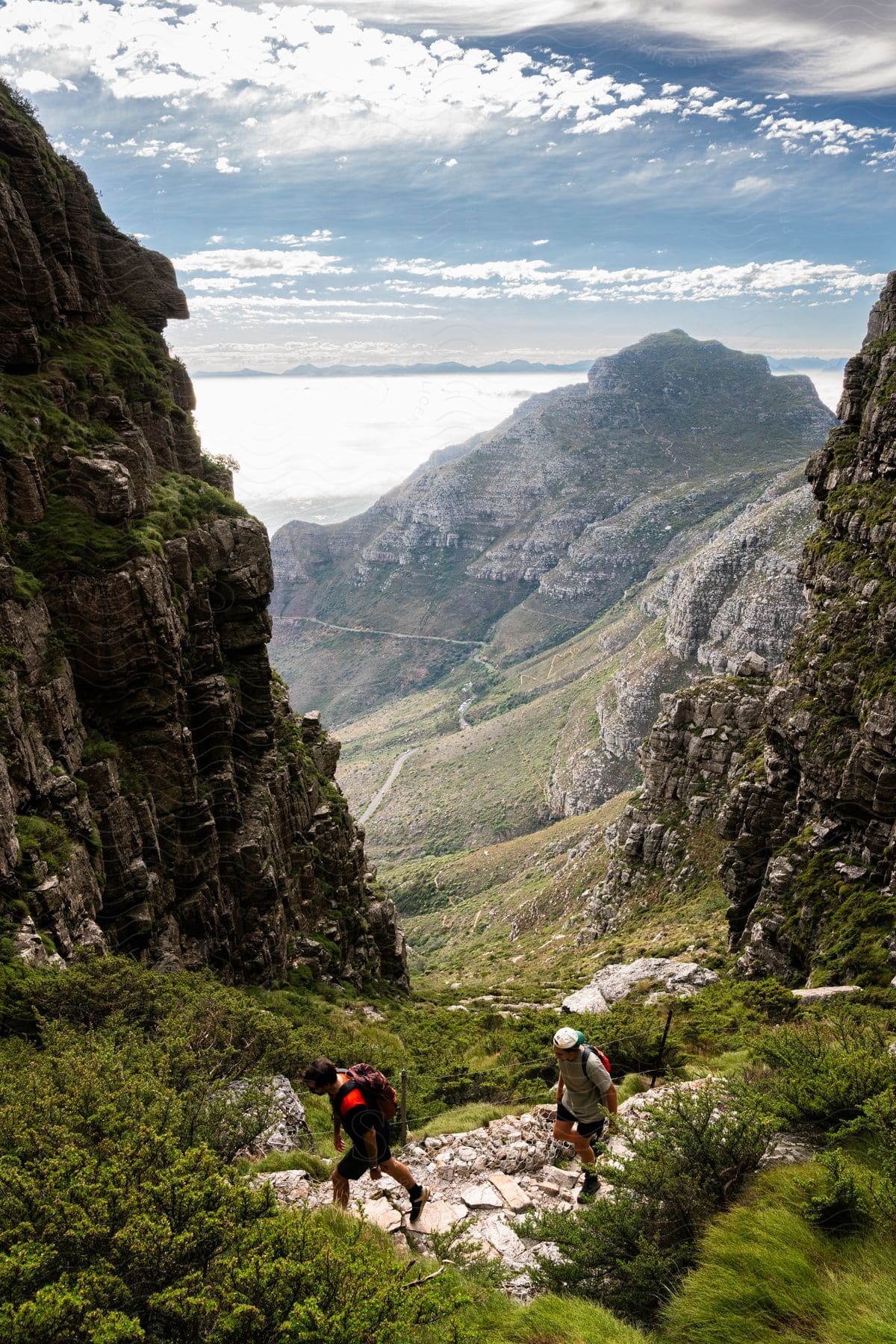 An Image Of Two Hikers In The Mountain