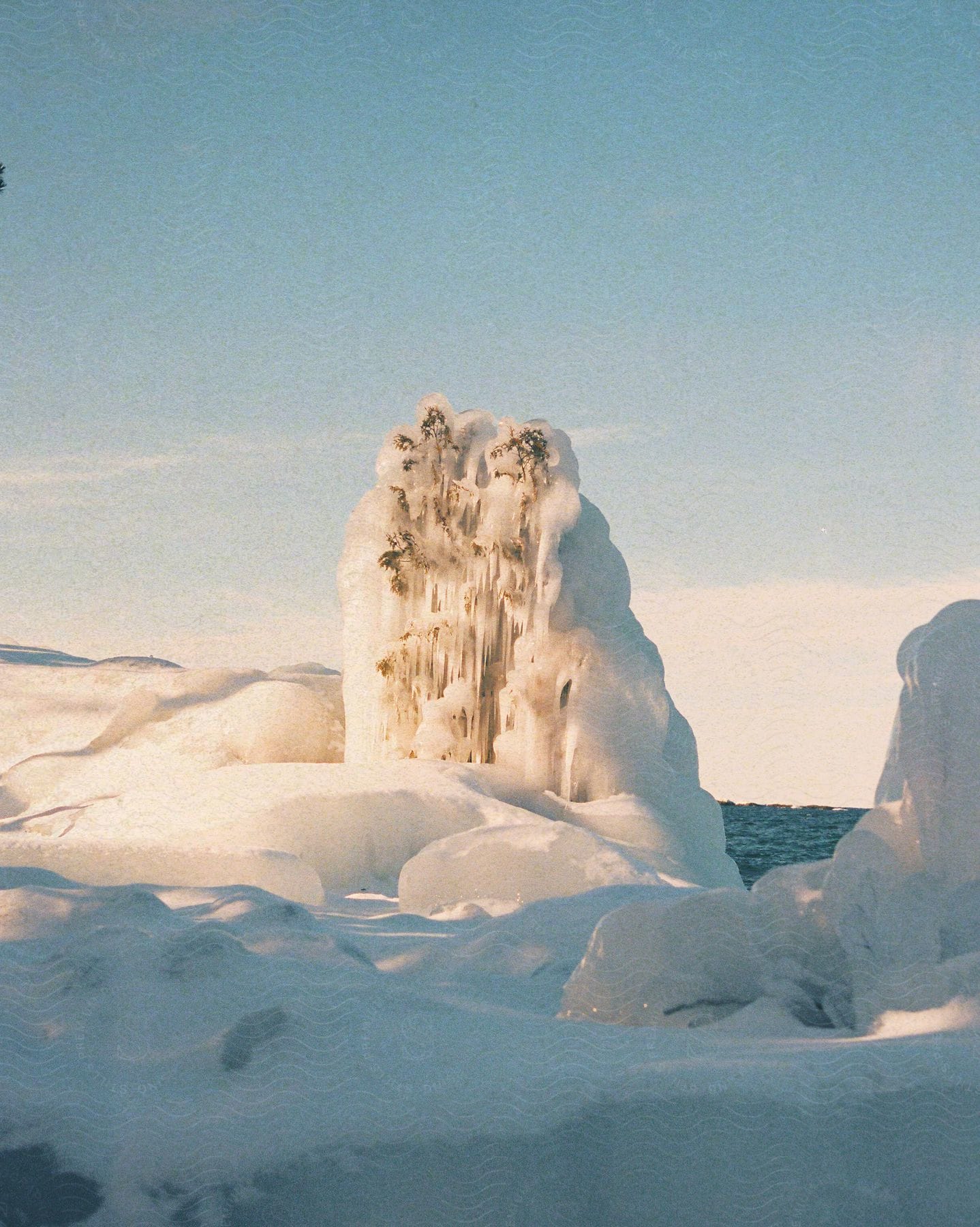 Sunlight shines upon arctic iceberg formations