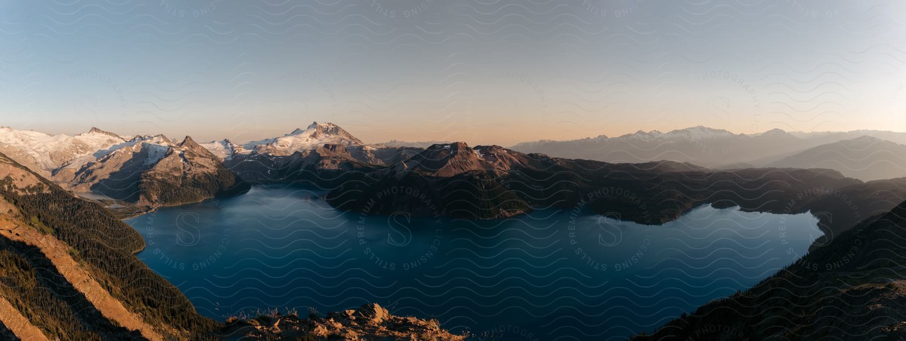 A lake at the base of several mountains