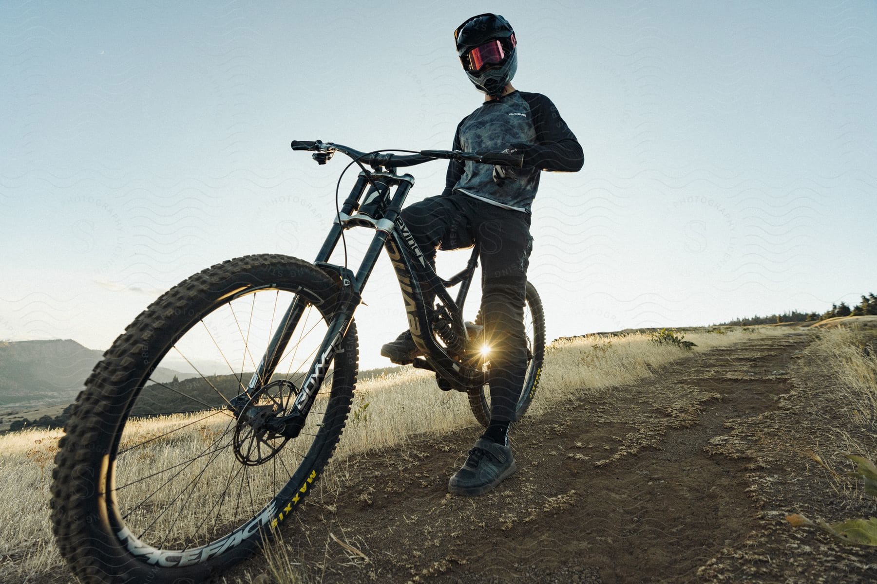 A person riding a mountain bike down a trail