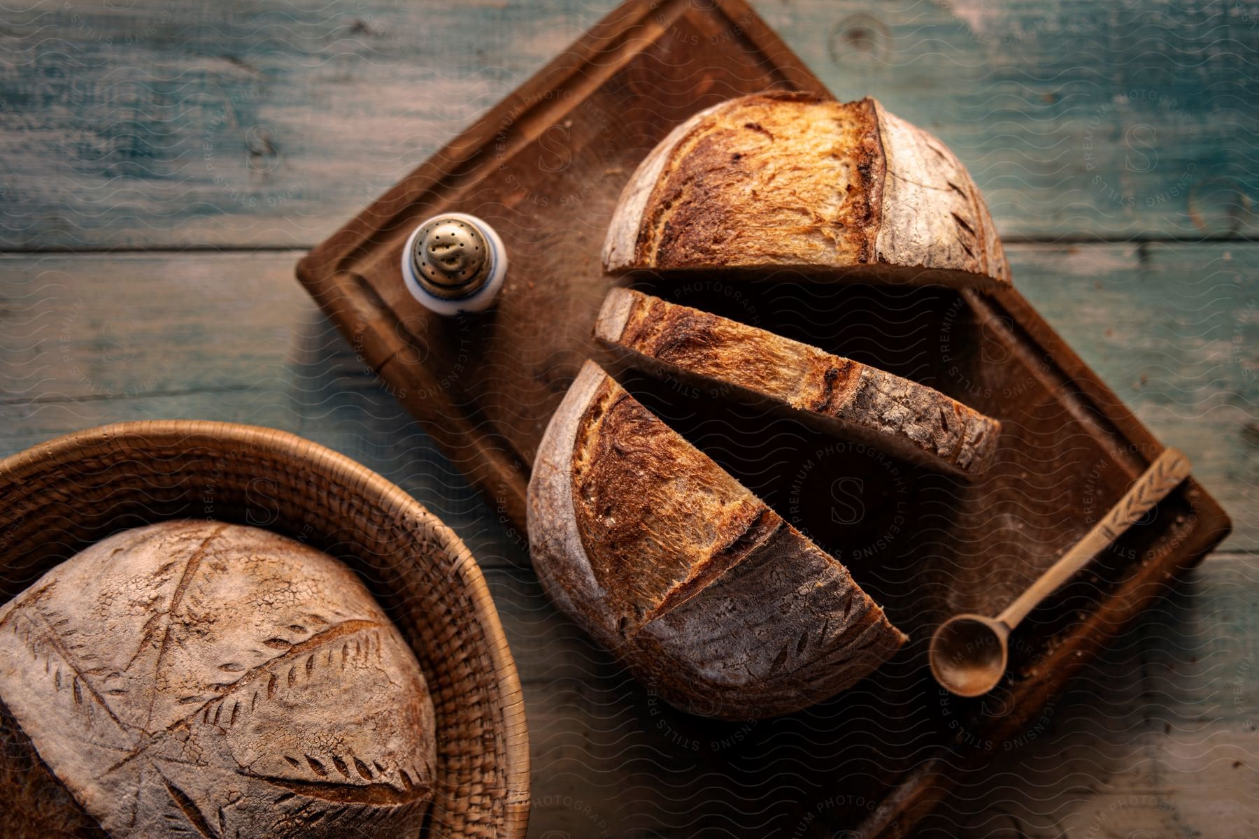 Rustic crusty bread on a wooden cutting board.