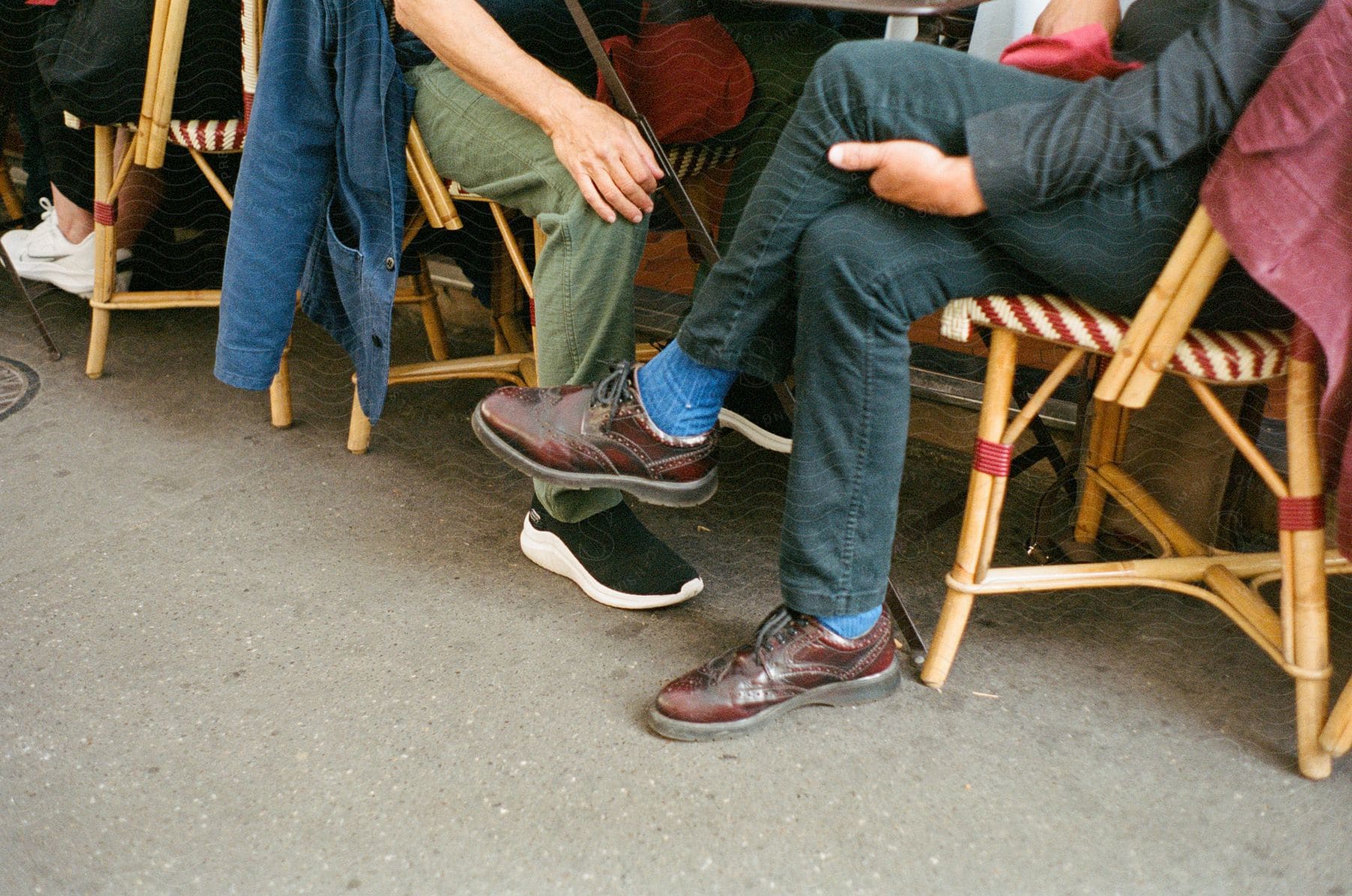 Two people sitting outdoors in a city