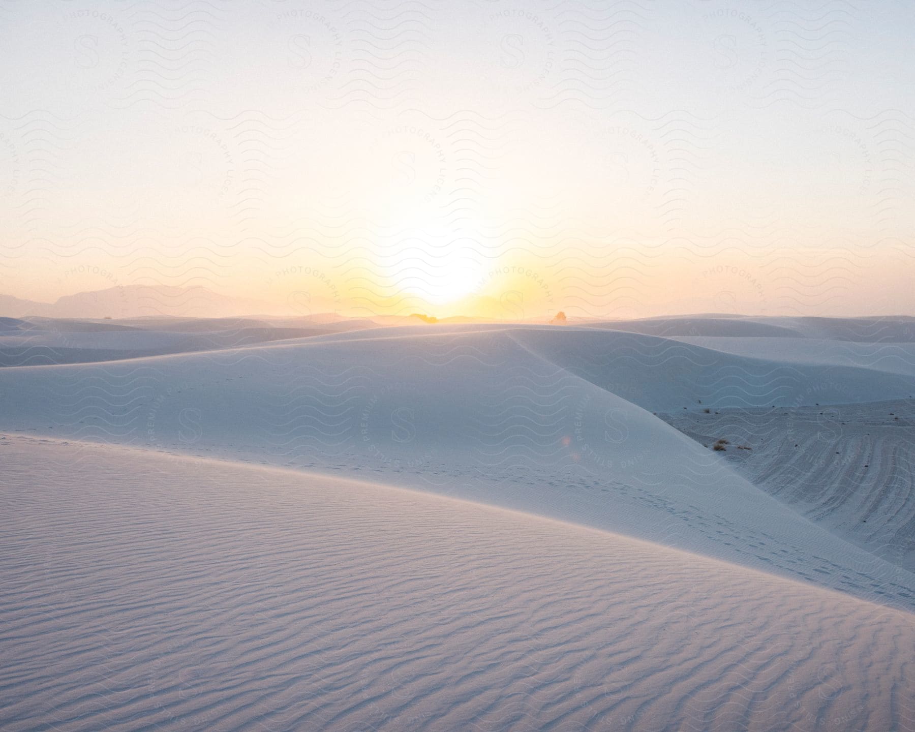 A view of the desert with some large sand dunes