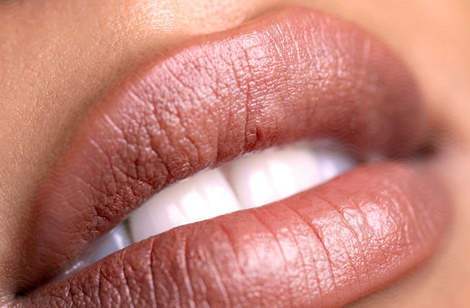 Extreme close up of a woman's lips with lipstick