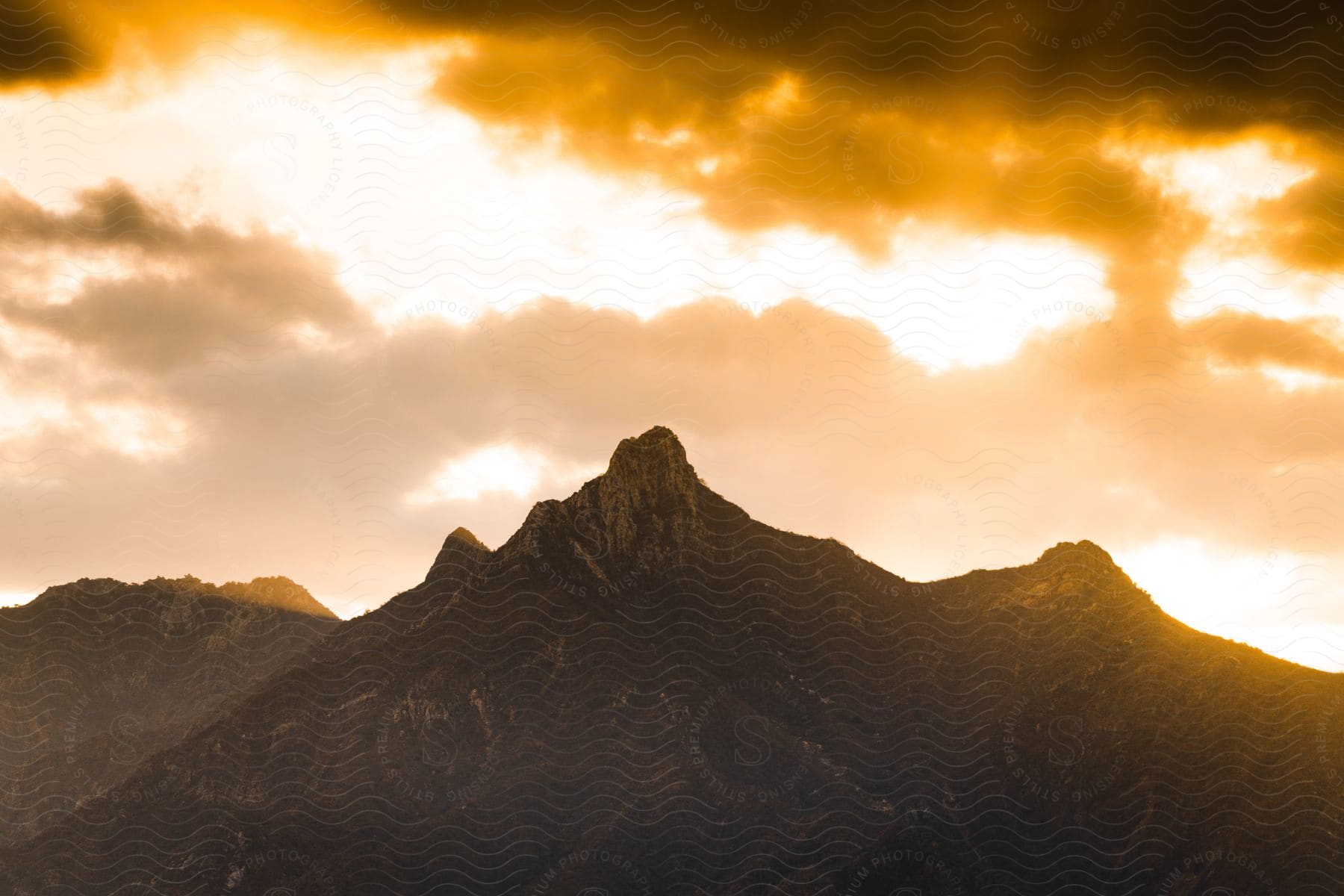 A rocky mountain peak at dawn.