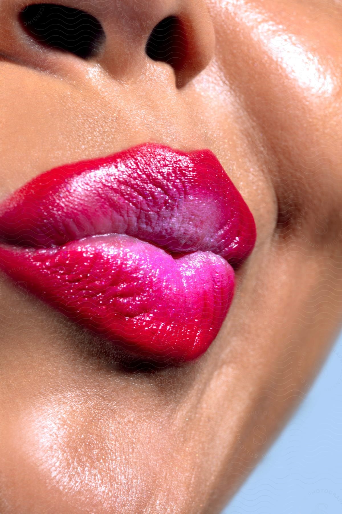 Woman's mouth pouting with pink lipstick