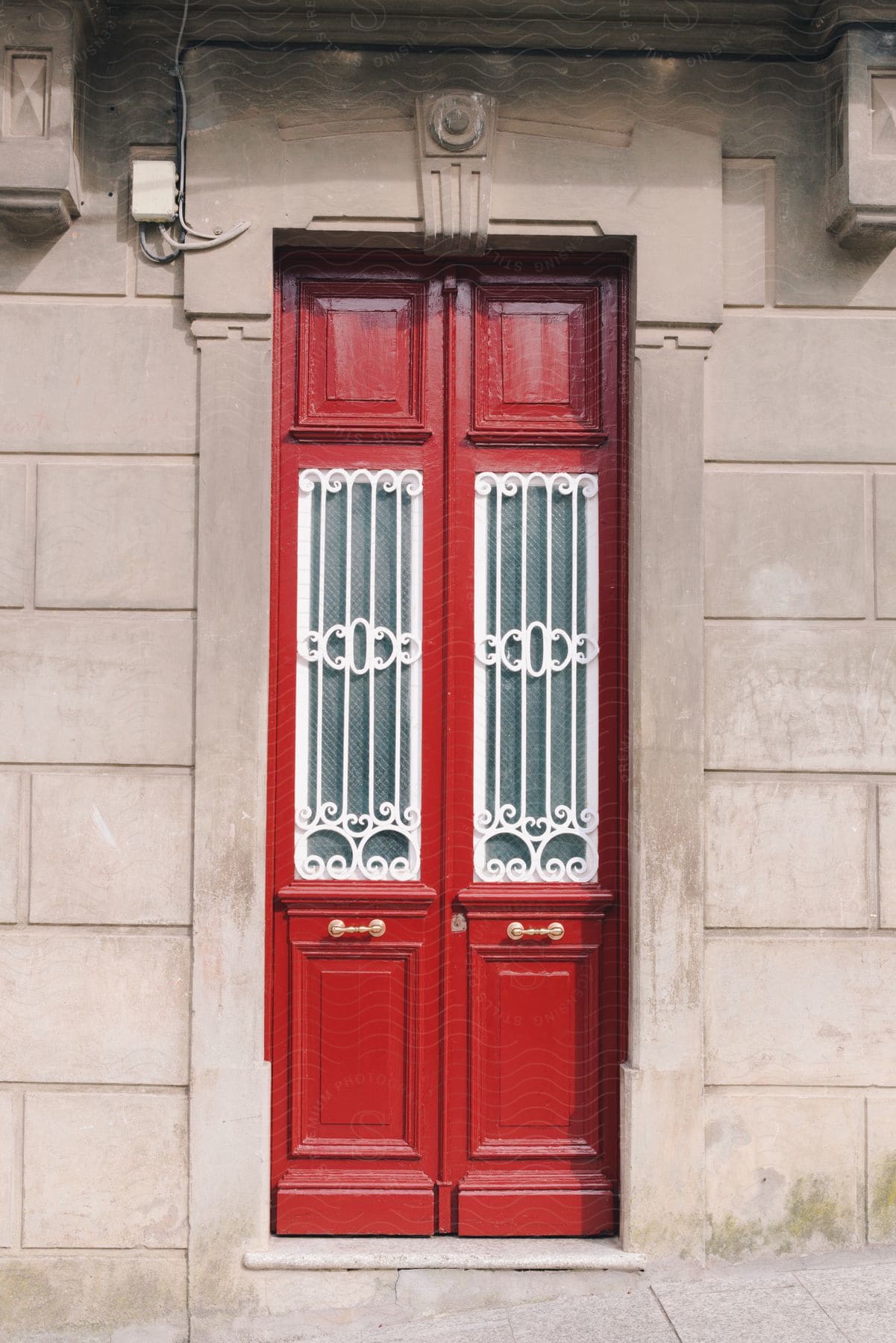 Exterior architecture of a vintage red door in daylight