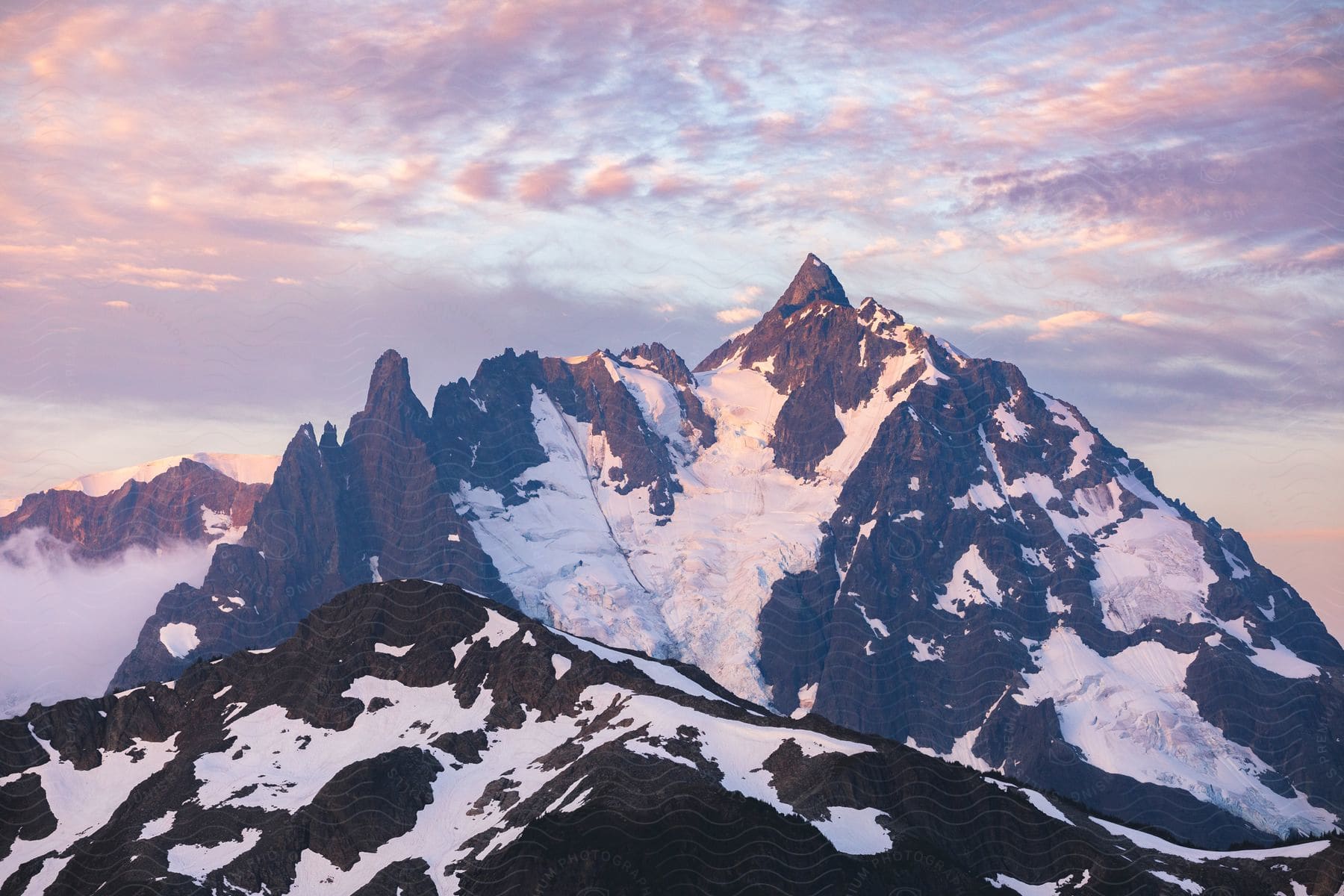 Some high mountains with snow and ice on them