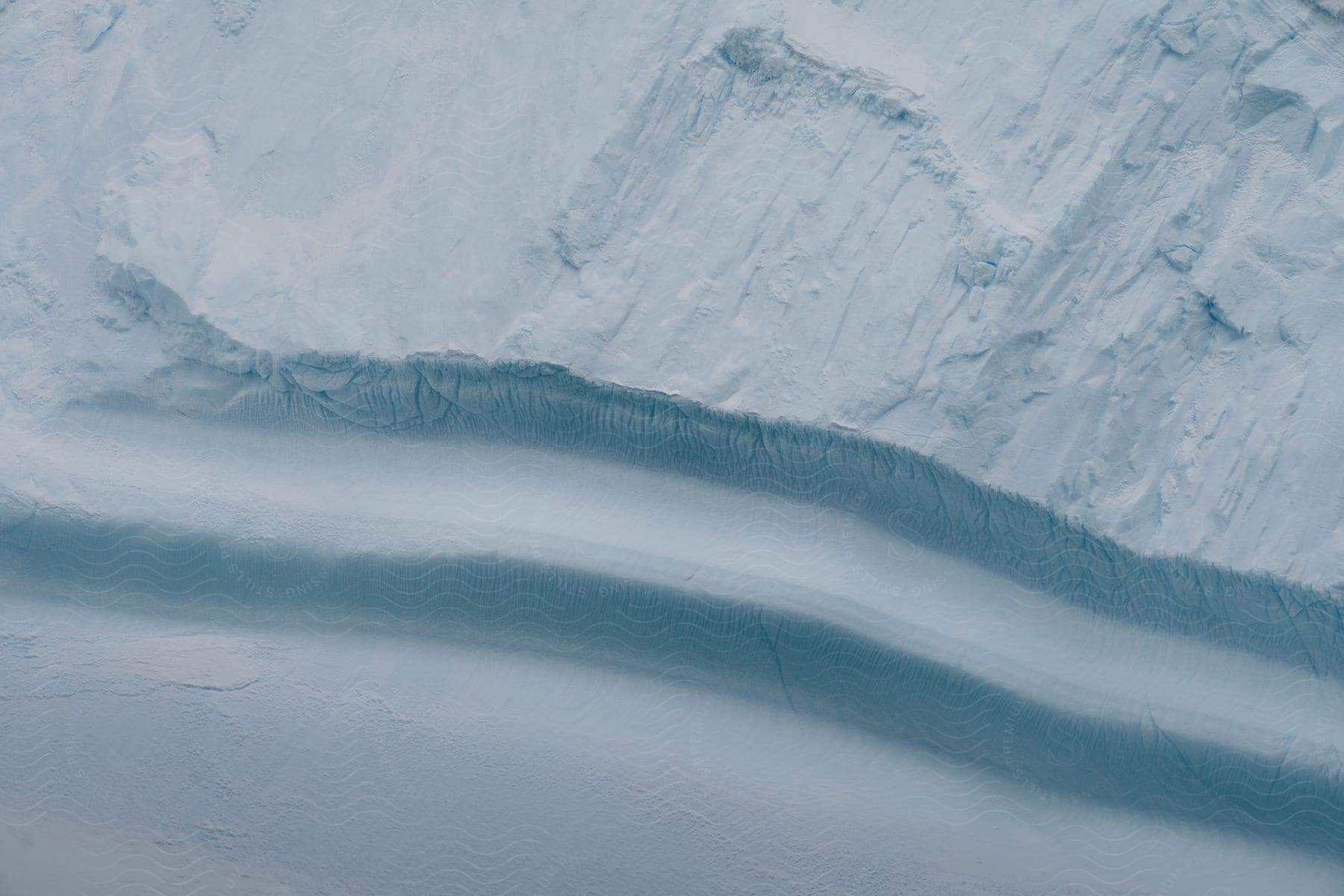 A look at a snowy ice cap from the bottom.