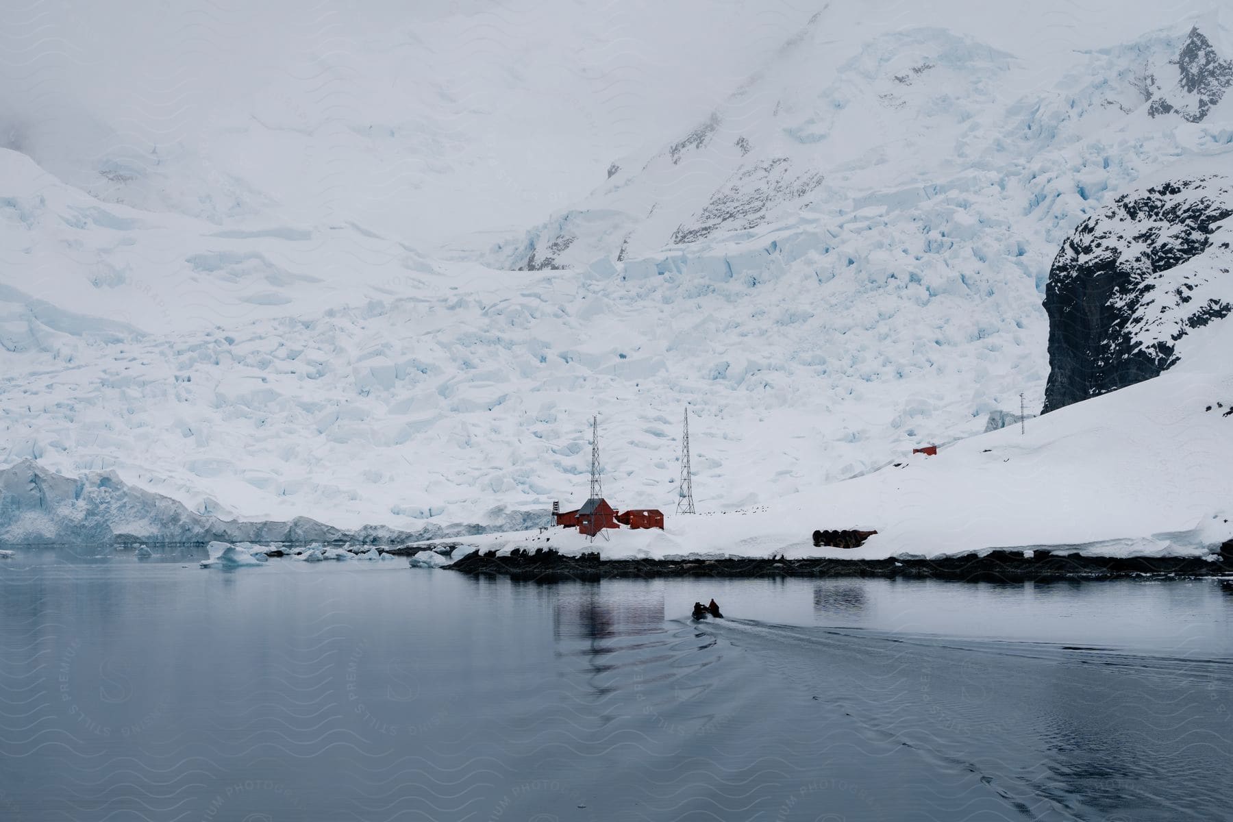 a snowy bank with snowy hills beyond it.