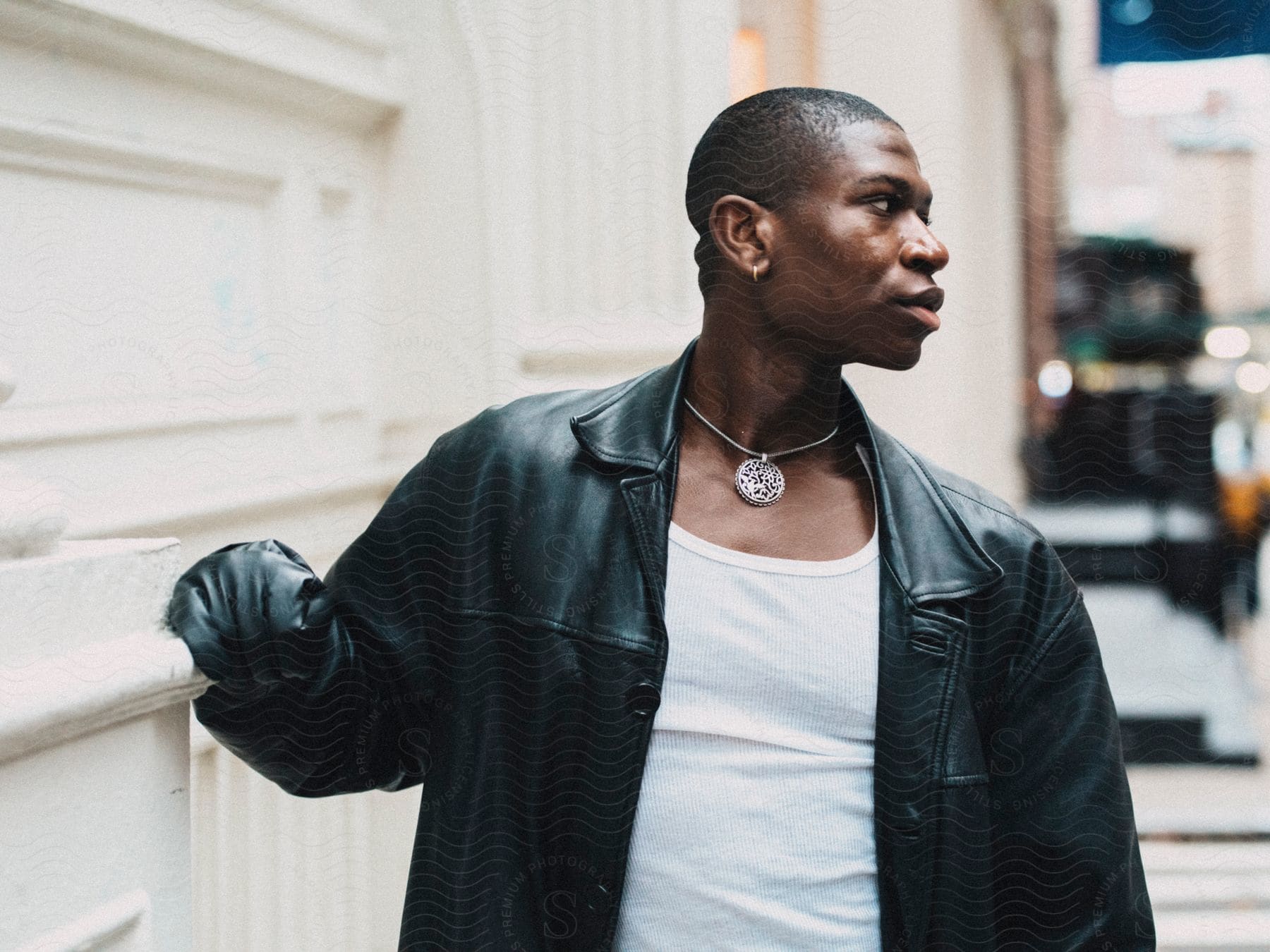 A clip of a black male model on a black coat