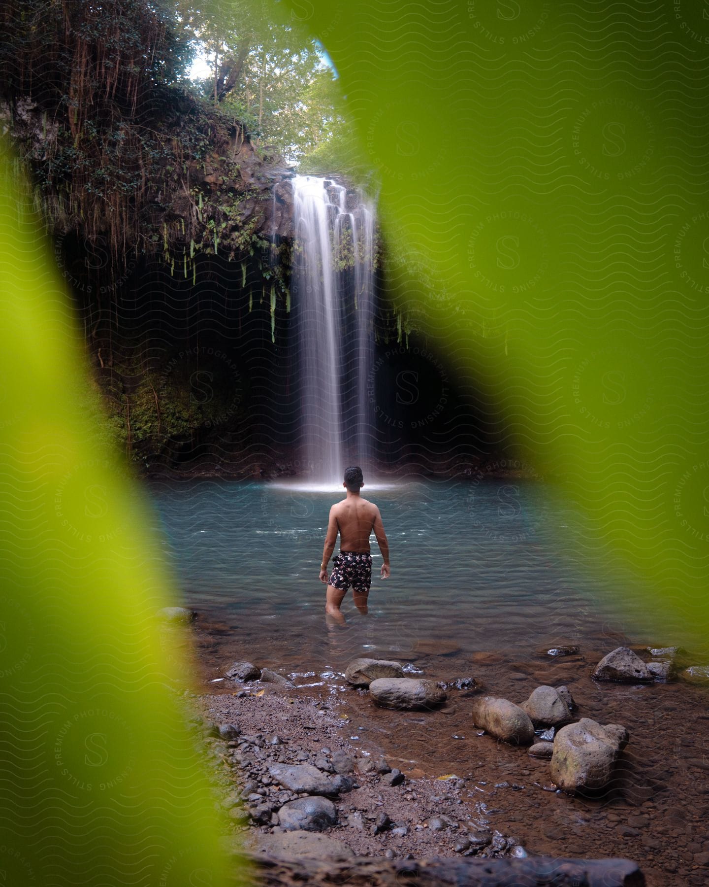 An image of a man in a water fall