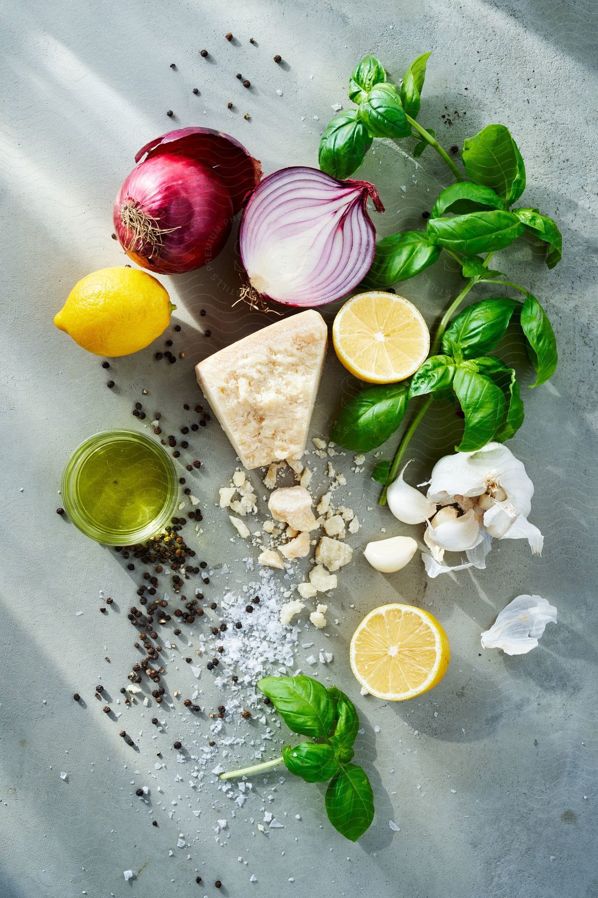 Red onions and lemons with garlic and other ingredients on a table