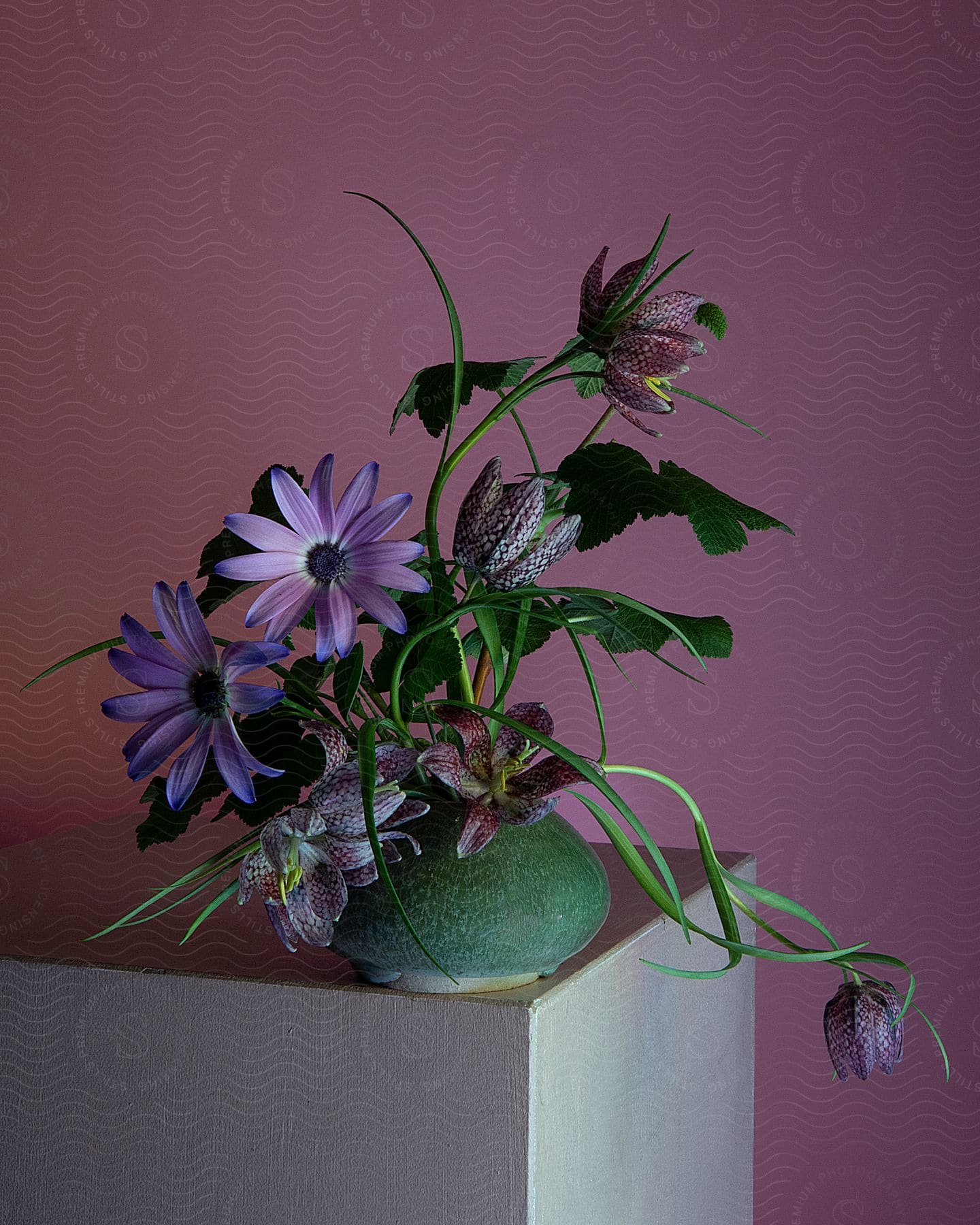 purple floral in green vase still life