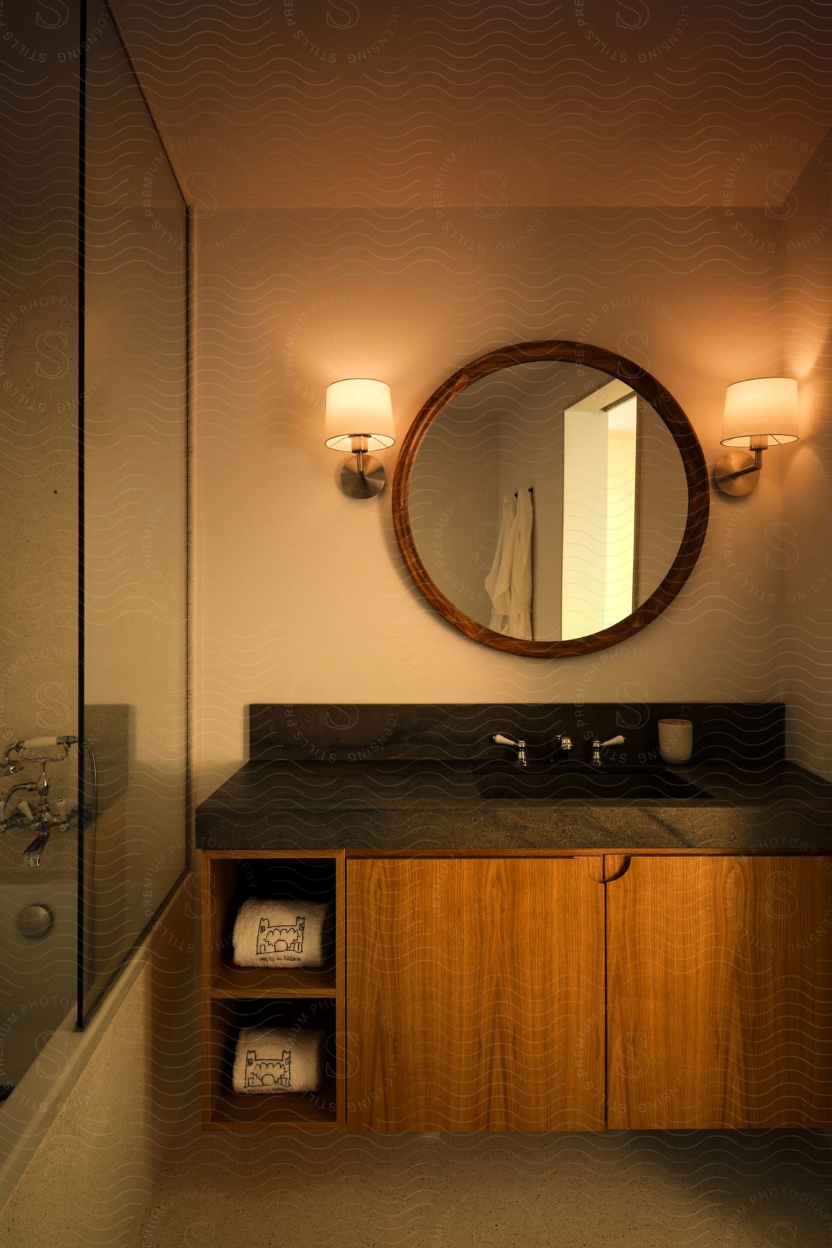 The inside of a bathroom with a vanity and mirror