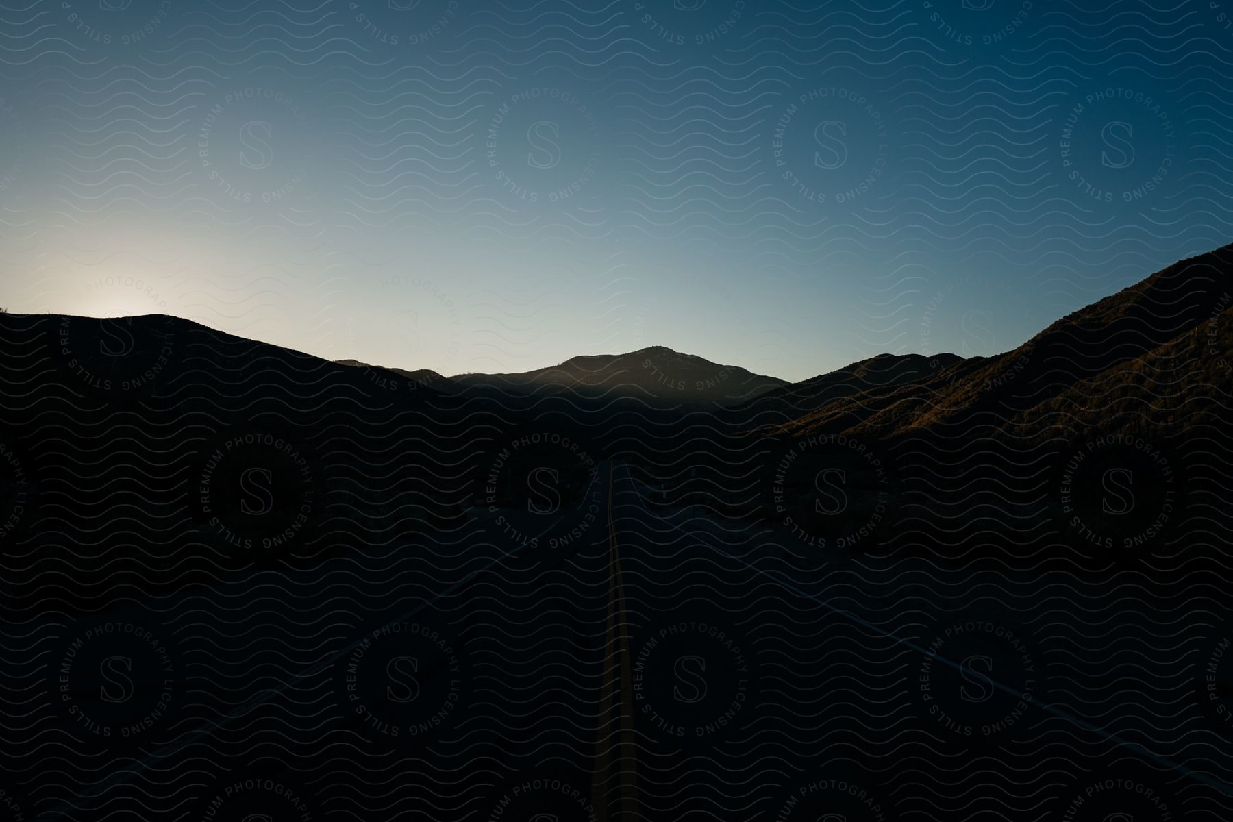 A serene mountain landscape at dusk in california