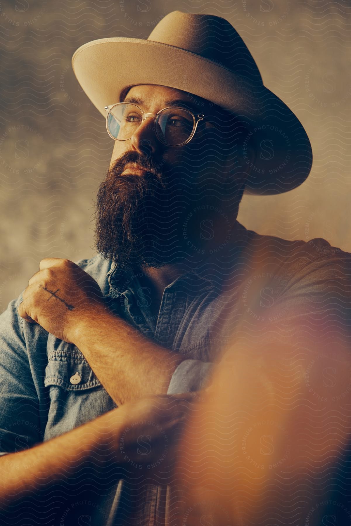 A Man Wearing Glasses And A Hat