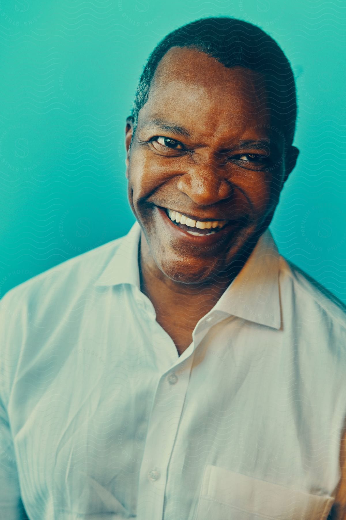 An older man smiling