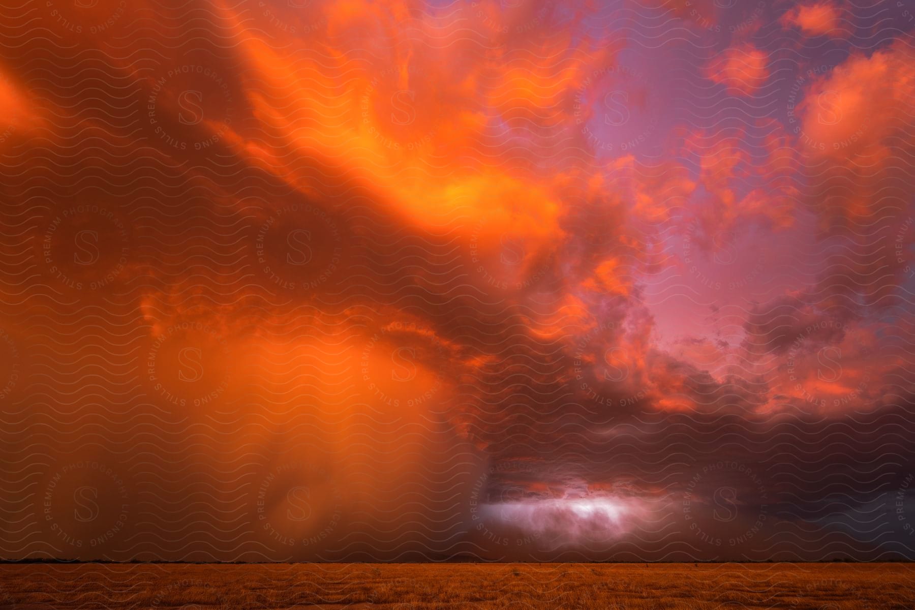 Clouds gather around the sky in an outdoor setting capturing the natural landscape and atmosphere