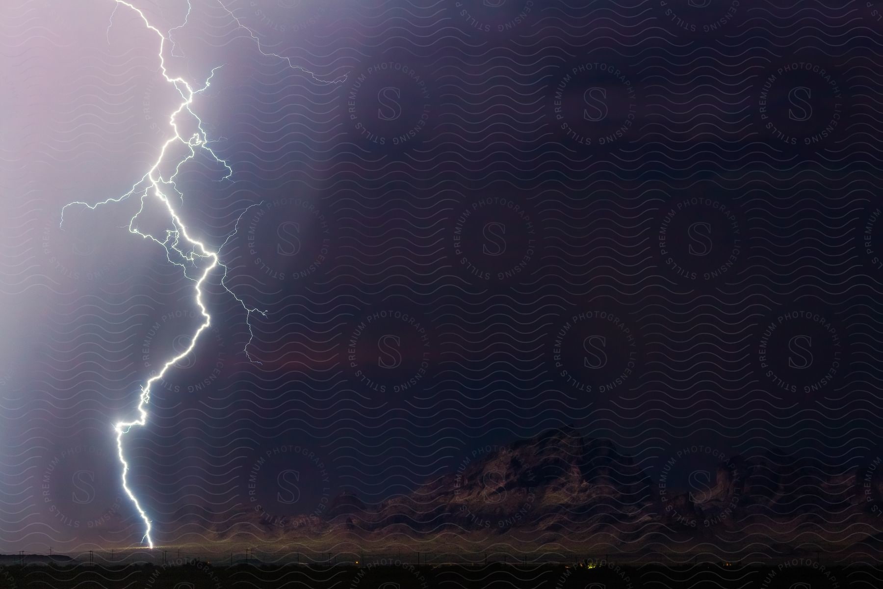 A lightning bolt illuminates the saddle mountains in harquahala az