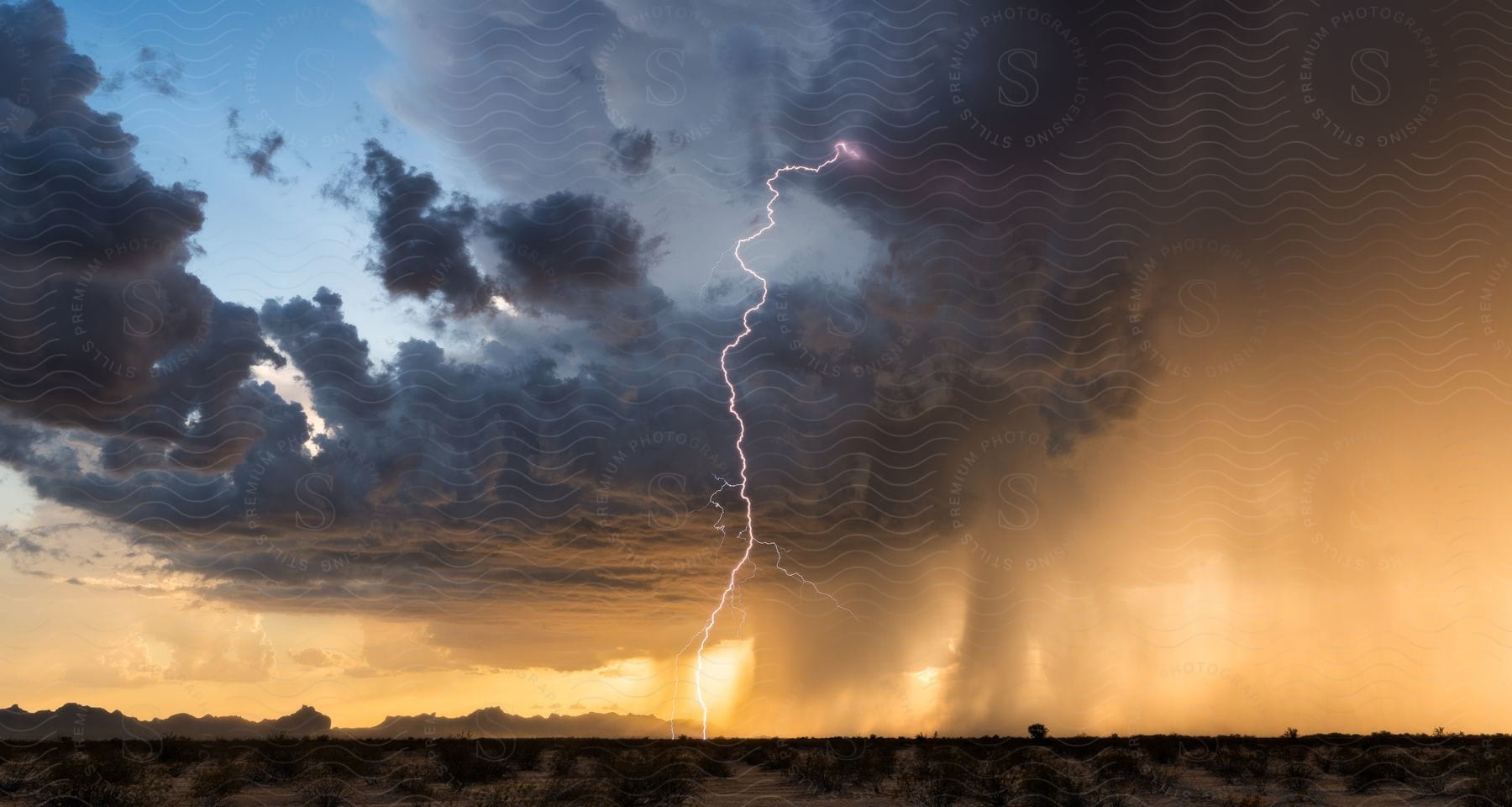 A powerful lightning strike emerges from a severe thunderstorm