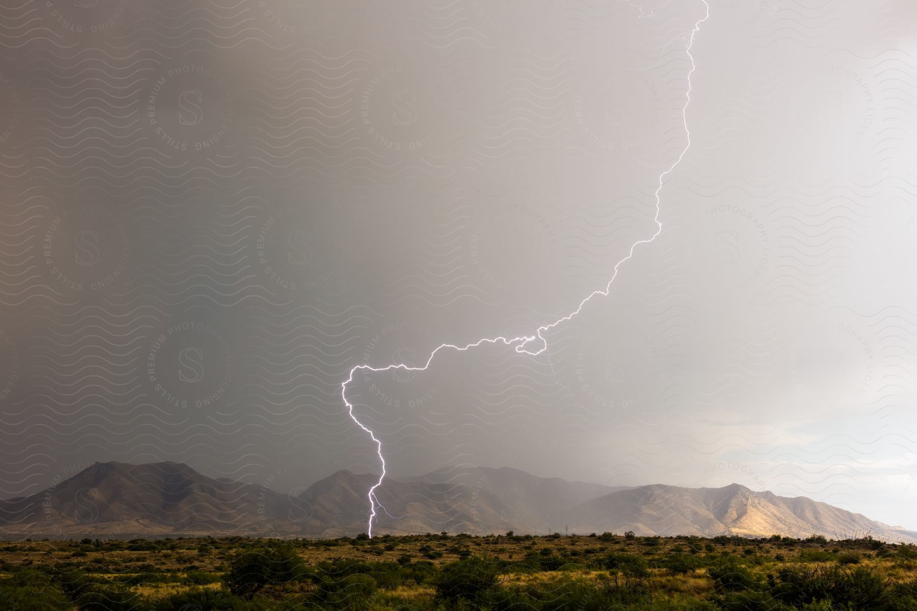 A lightning bolt strikes during a storm over the dragoon mountains in southeastern arizona